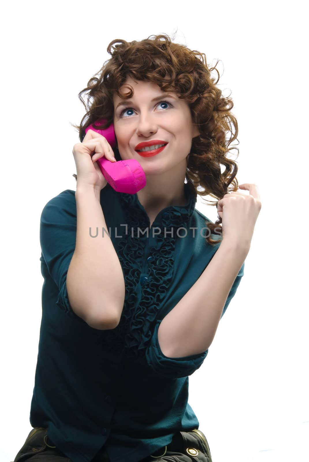 Young woman holding handset. Isolated on white
