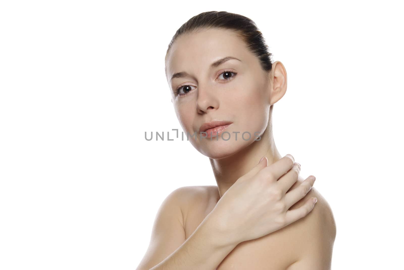 Portrait of young beautiful serene girl with healthy complexion. Isolated on white background