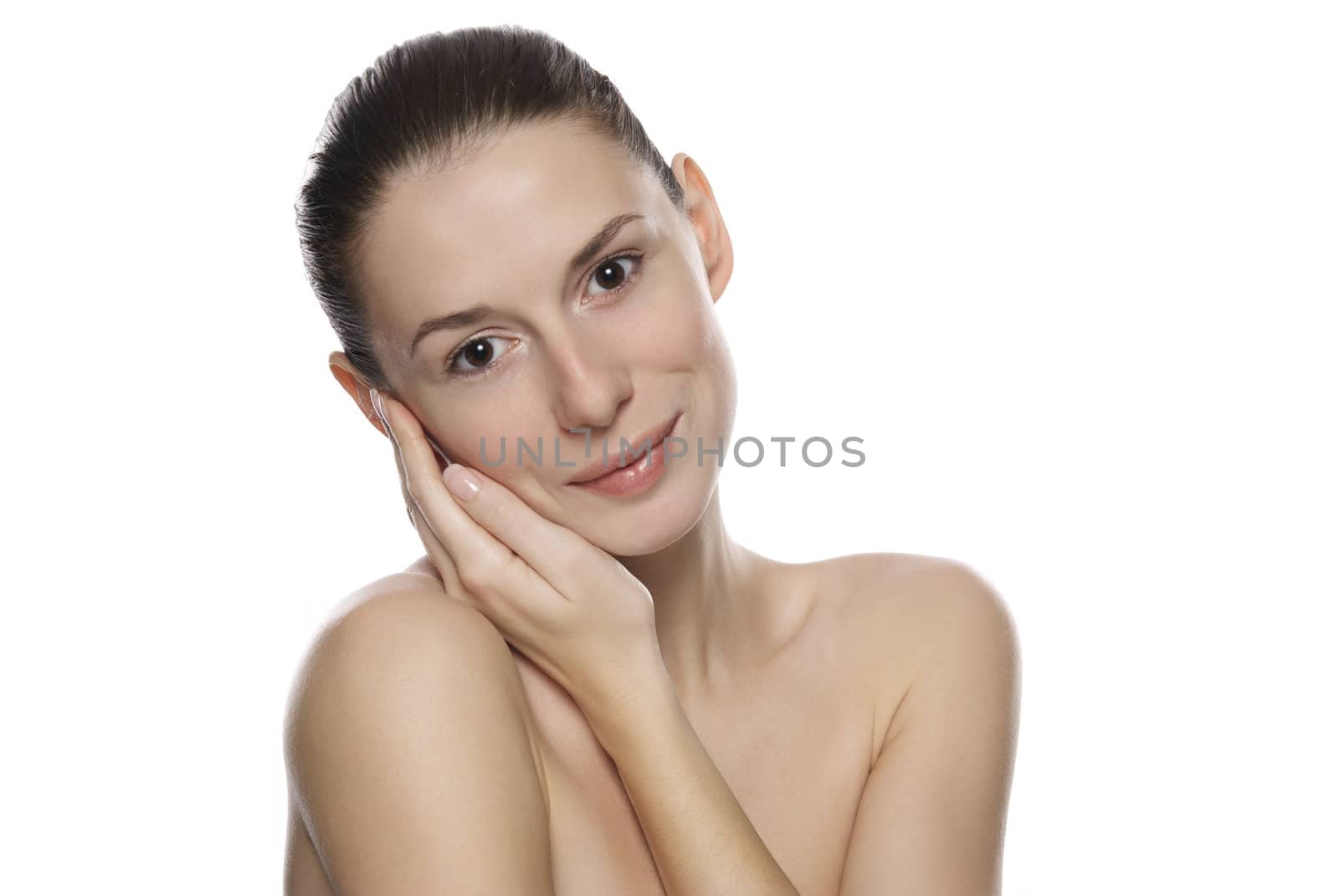 Portrait of young beautiful serene girl with healthy complexion. Isolated on white background