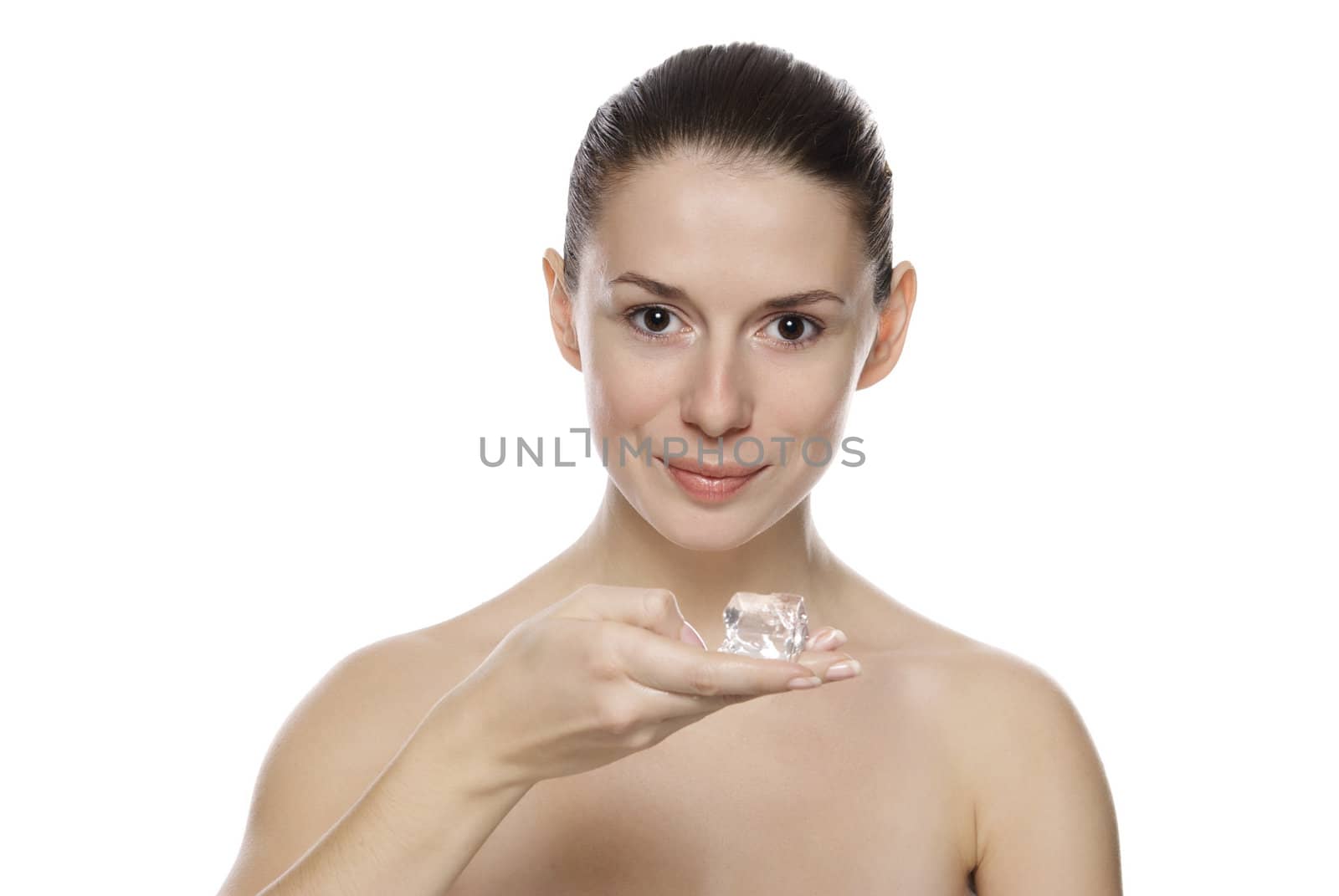 Portrait of young beautiful girl holding ice cube. Isolated on white background