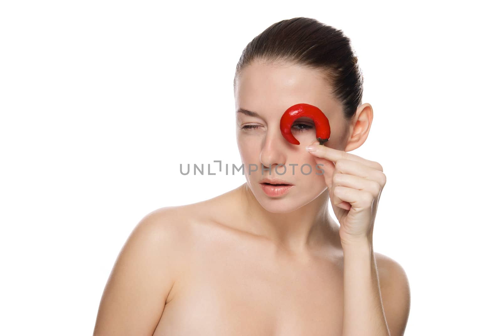 Portrait of a beautiful woman with chili pepper. Isolated on white background