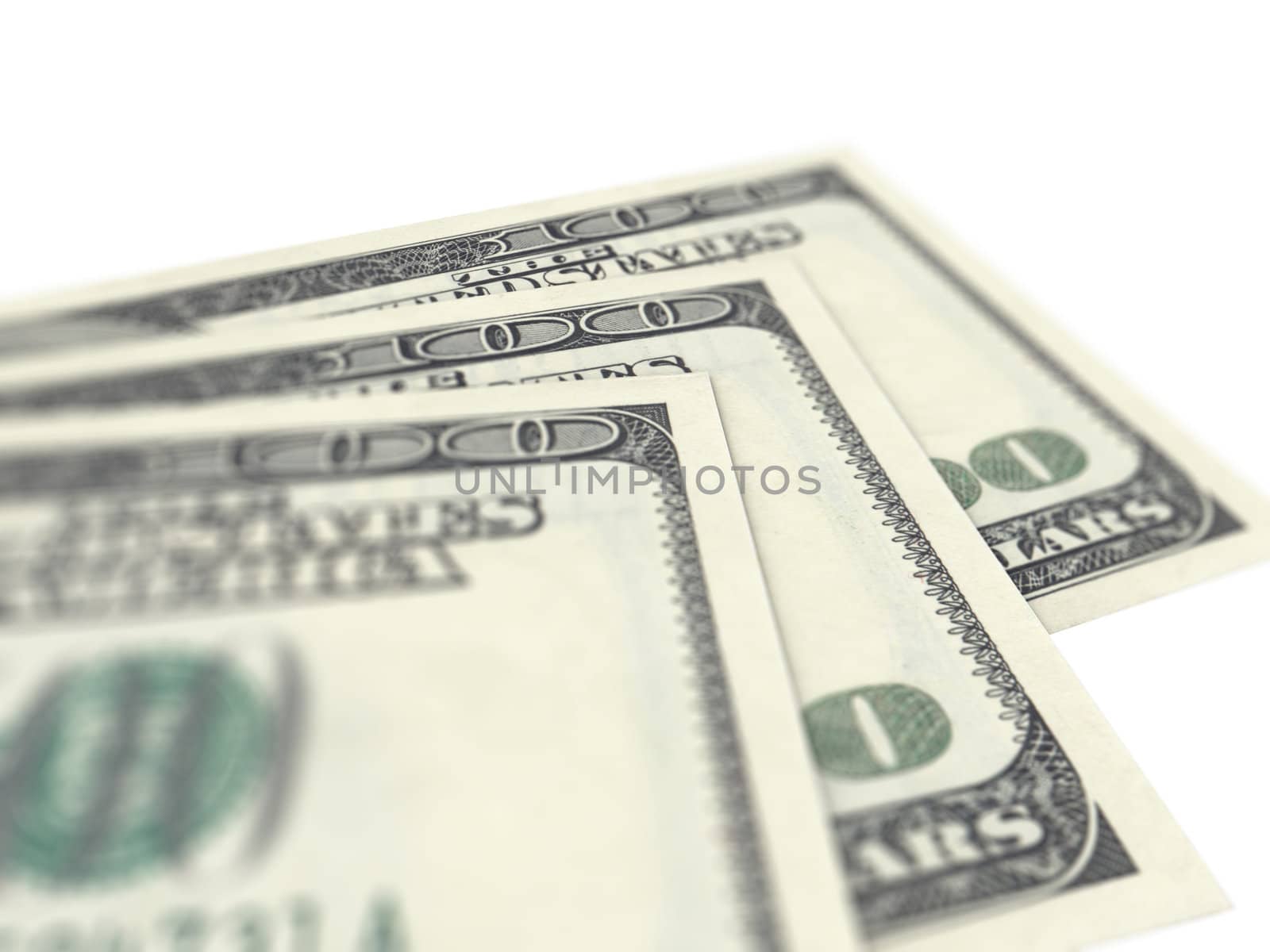 Three hundred dollar bills on white background with depth of field.