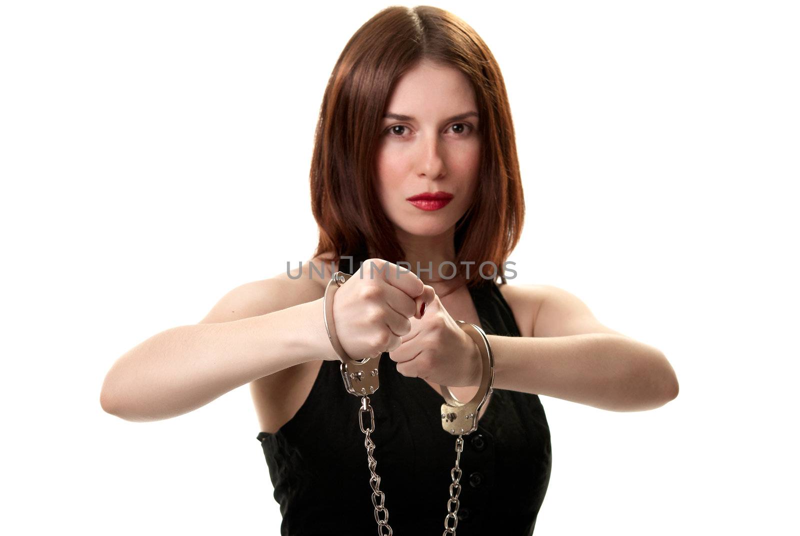 Young saxy brunette in handcuffs isolated on white background