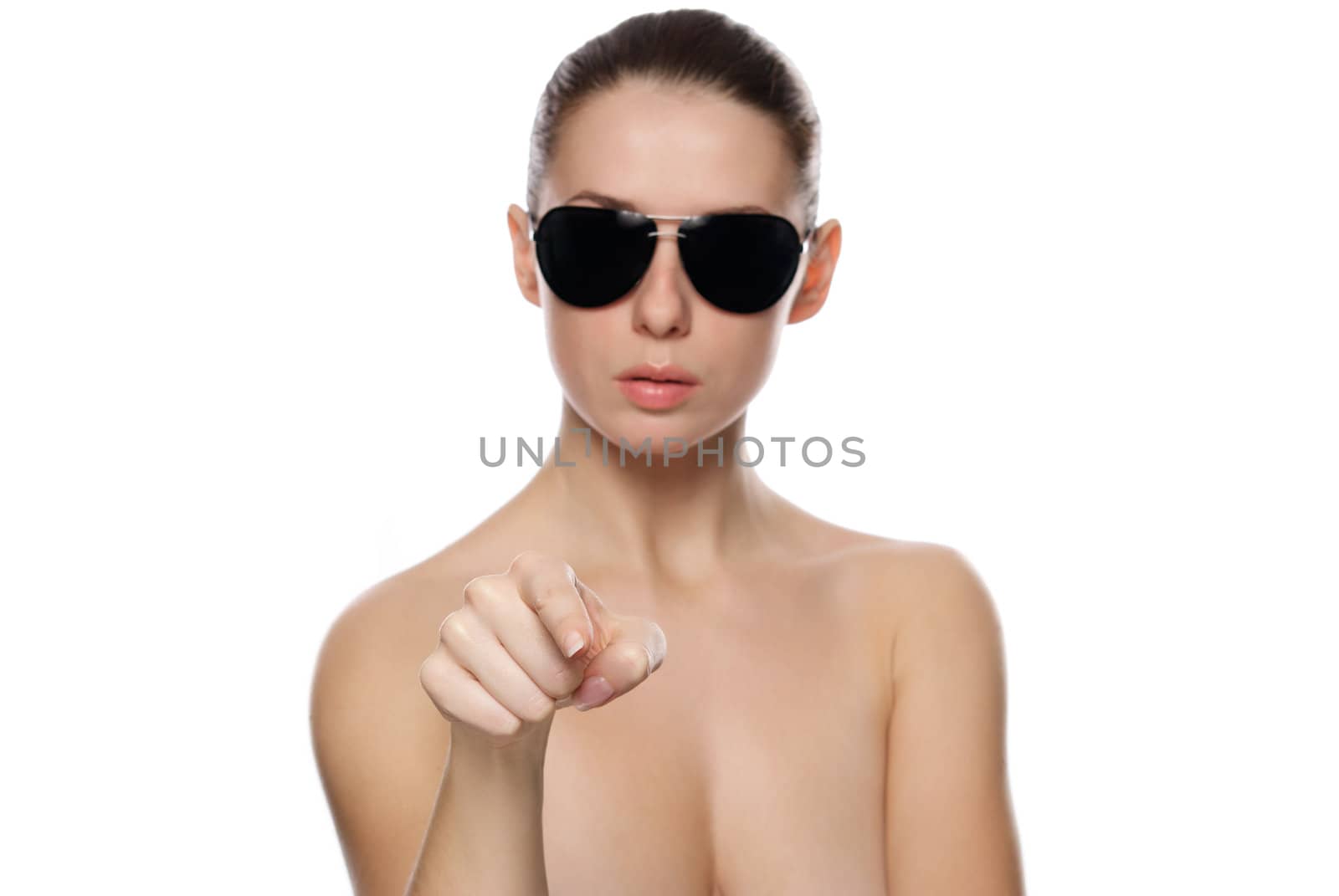 Portrait of glamour woman in sunglasses.  Shows forward. Isolated on white background. Small depth of field.