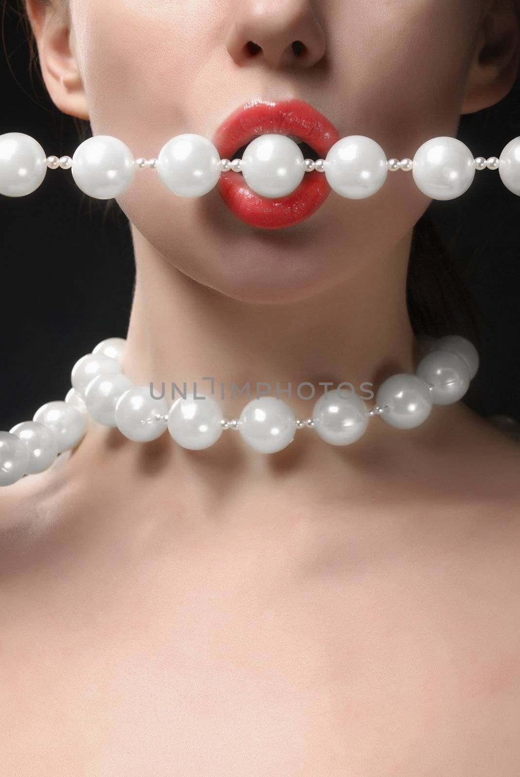 Woman open mouth with faux pearls