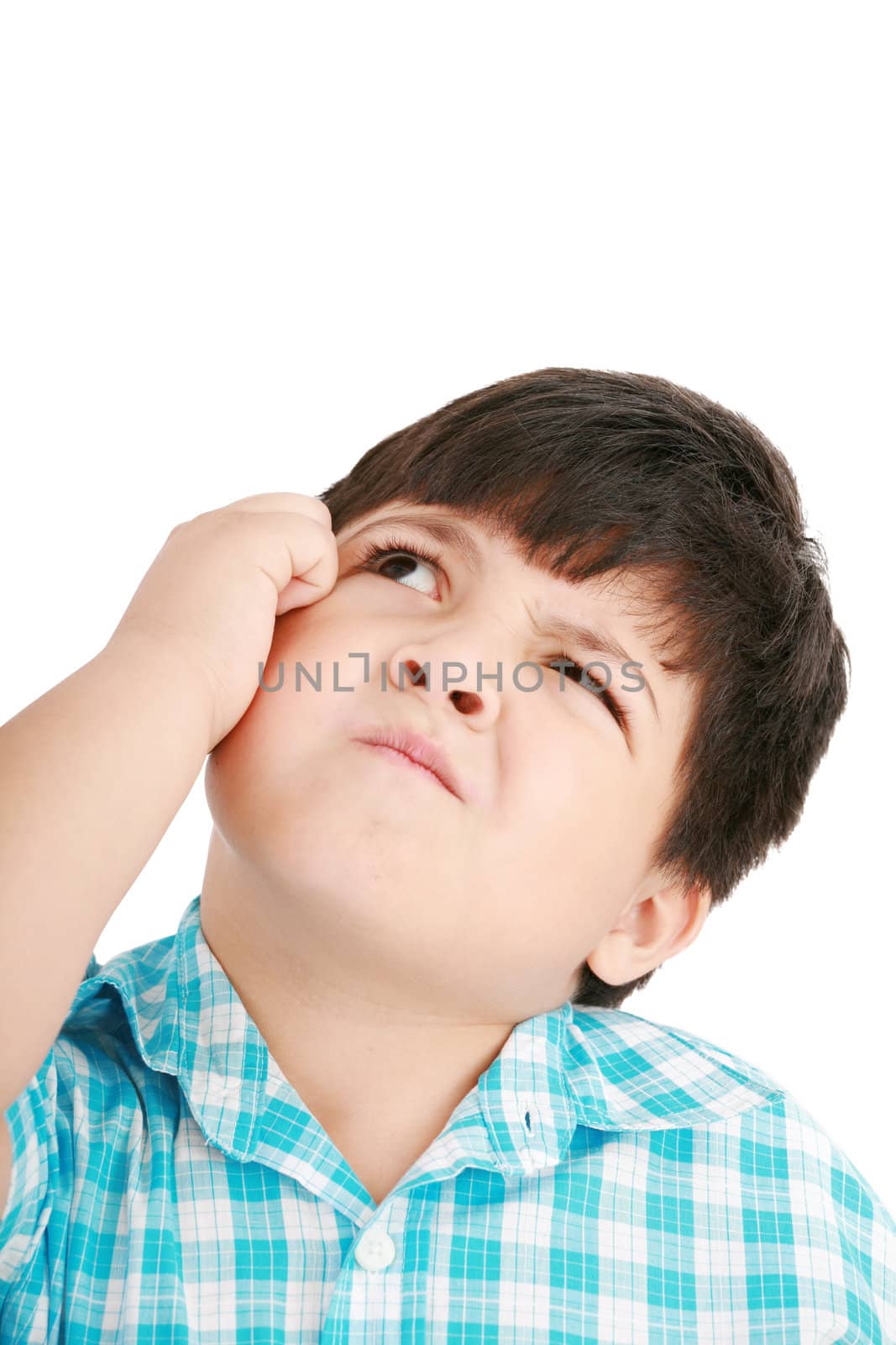 boy looking up and scratches his head, isolated on white by dacasdo