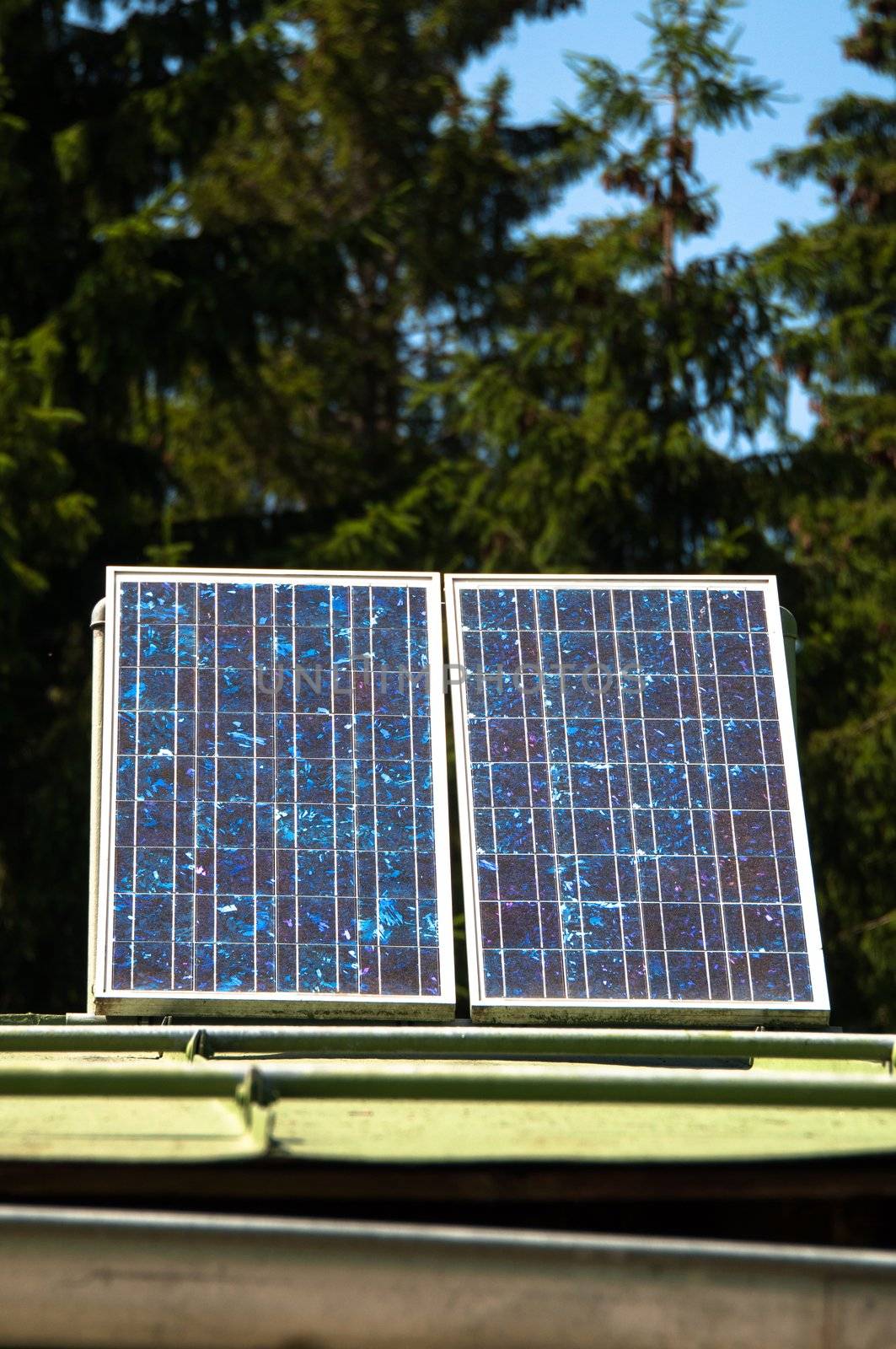 Rural mountain cabin with solar panels to ensure basic electricity off-site in the Bavarian Alps