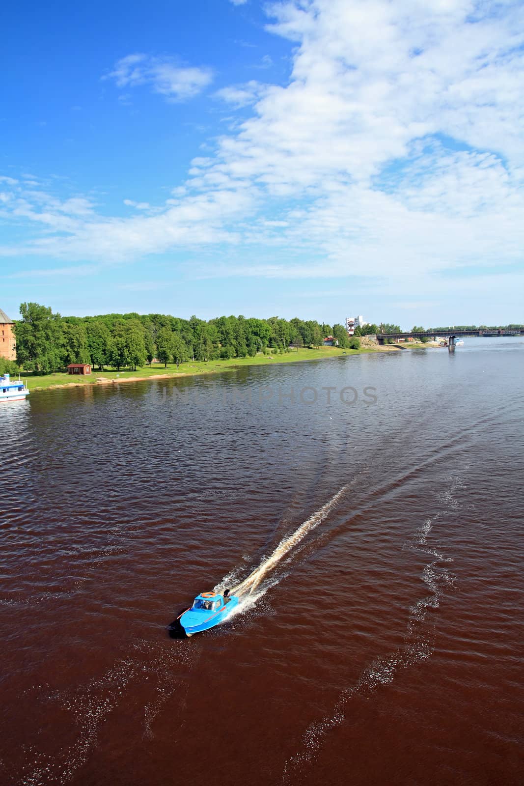 boat sails on broad river