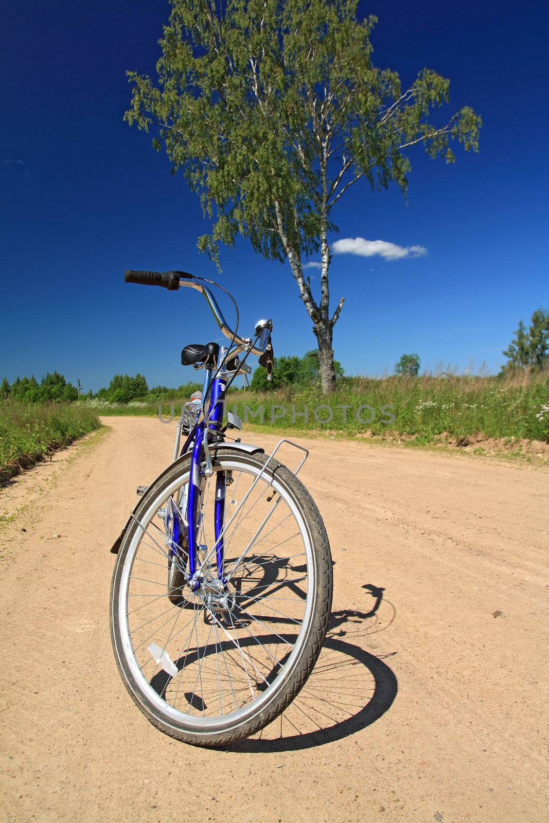 bicycle on sandy rural road by basel101658