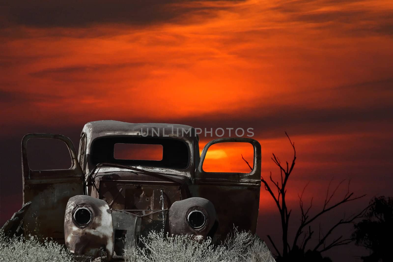 Montage of an old car against a sunset