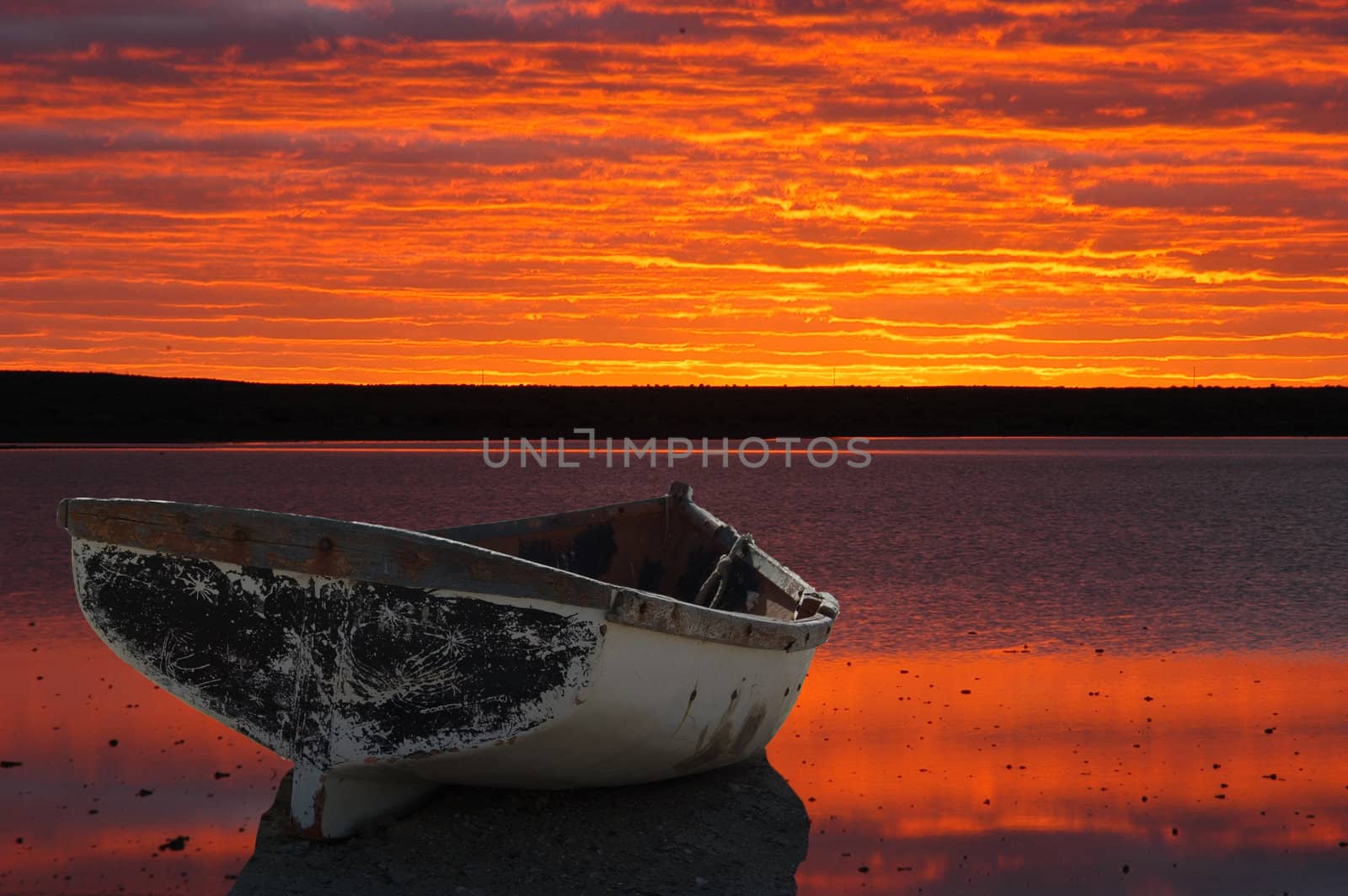 Montage of boat against sunset