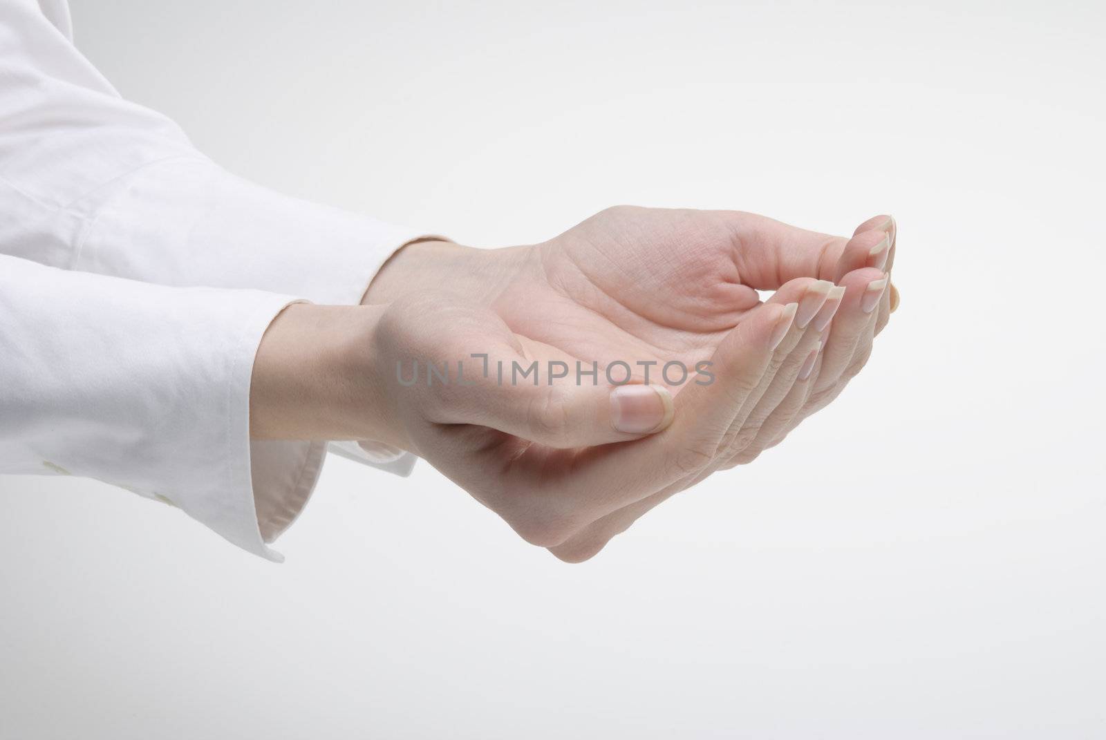 Woman's hand showing support symbol over light background