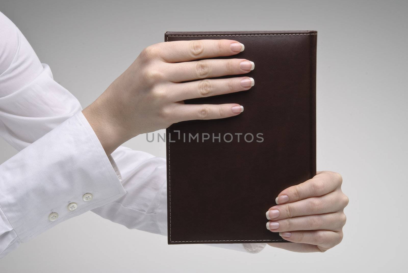 Woman's hands holding diary by kirs-ua