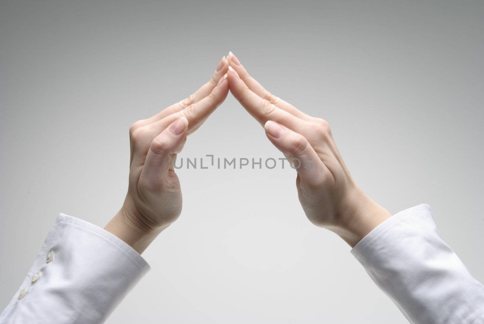 Woman's hand showing roof symbol  by kirs-ua