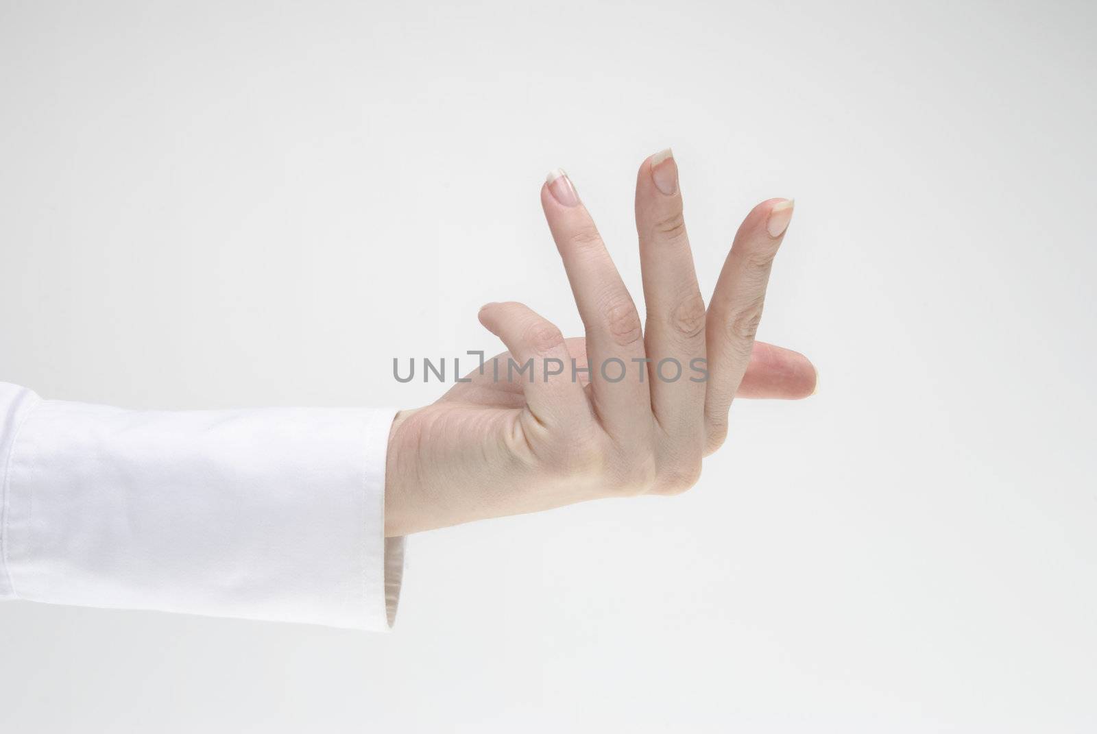 Woman's hand making gesture light background
