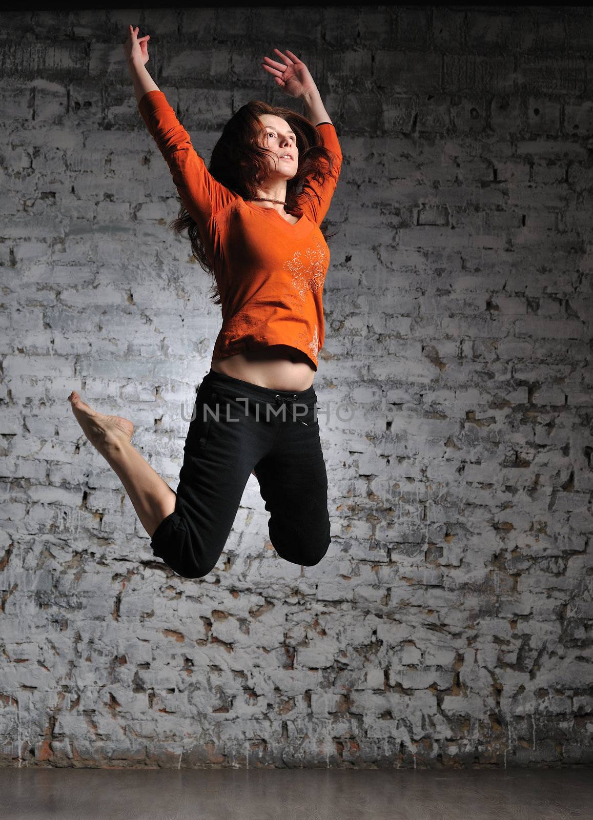 Girl in sportswear jumping by kirs-ua