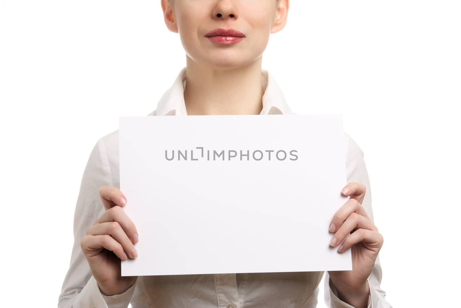Beautiful businesswoman in a white shirt holding a blank page. Isolated on white background