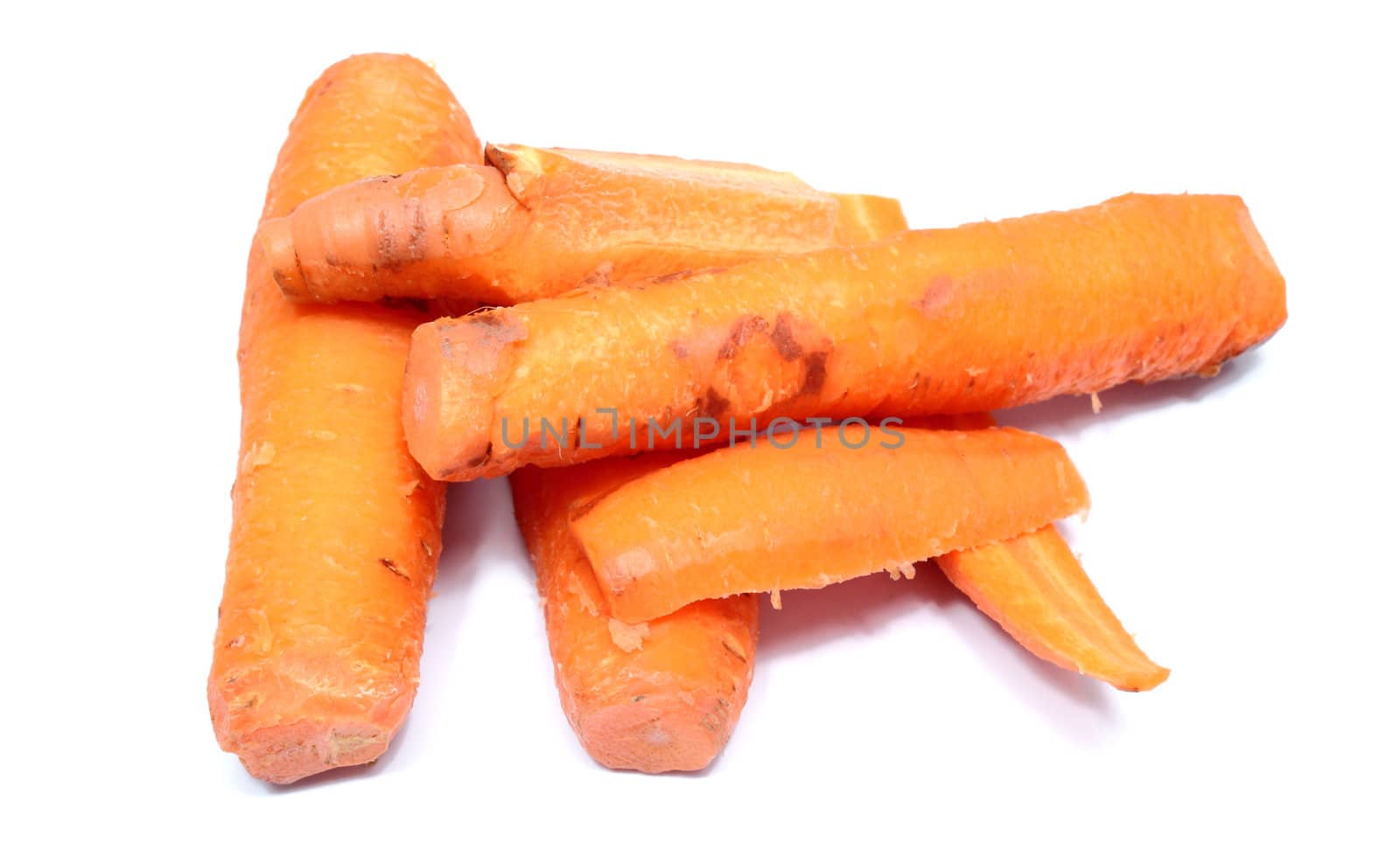 bunch of boiled carrots over white background