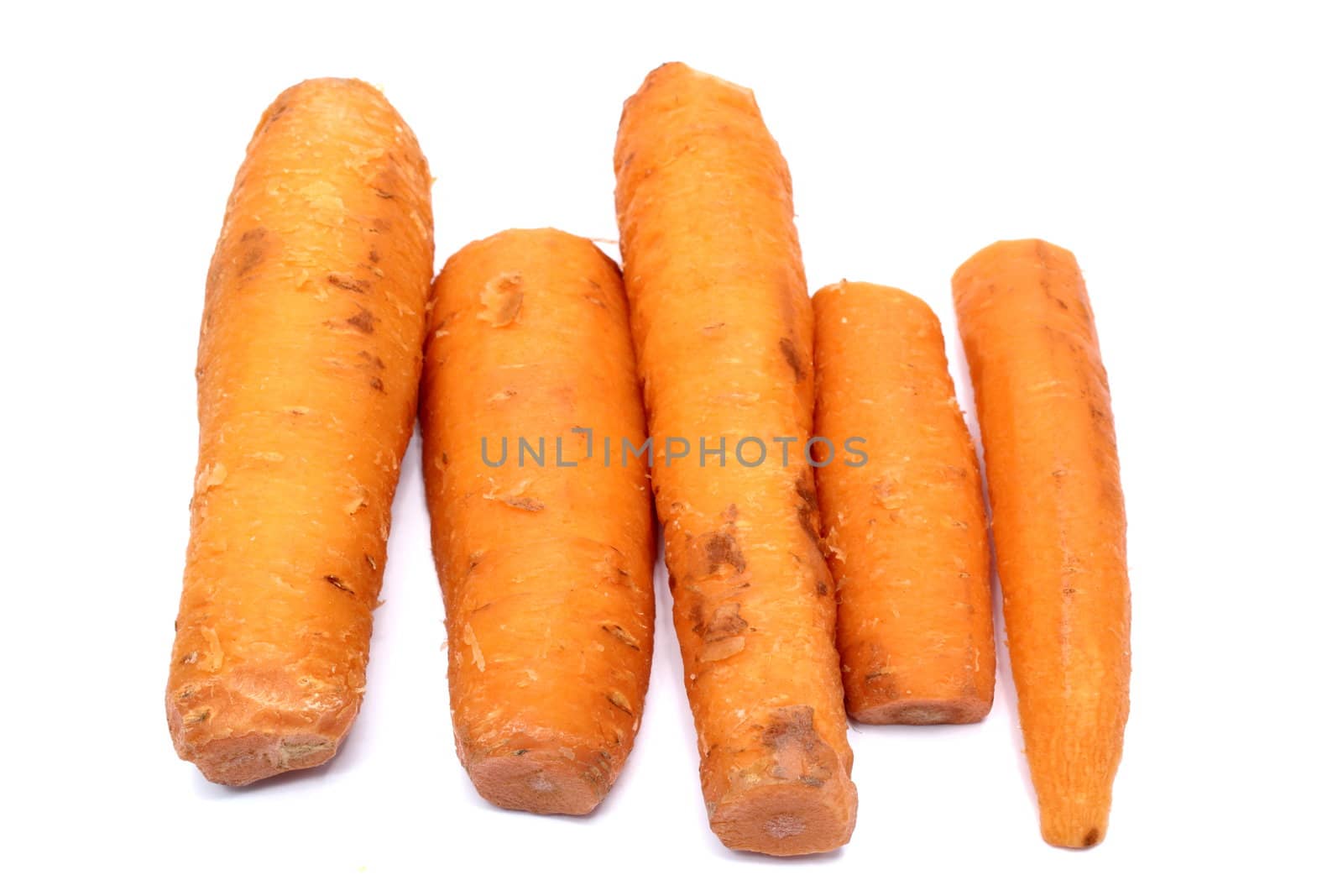 bunch of five boiled carrots ready for soup
