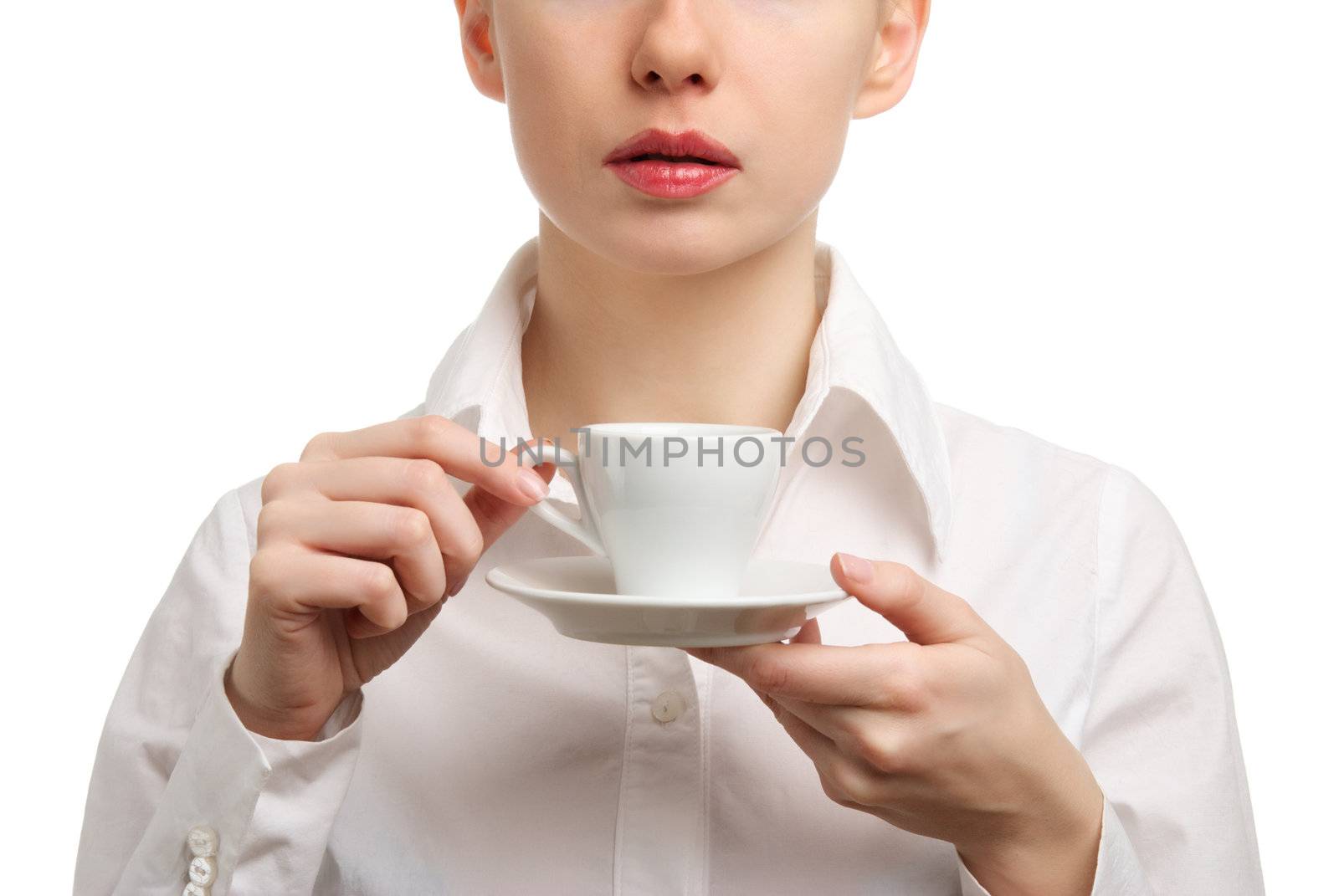 Portrait of a beautiful businesswoman in a white shirt drinking coffee or tea. Isolated on white background