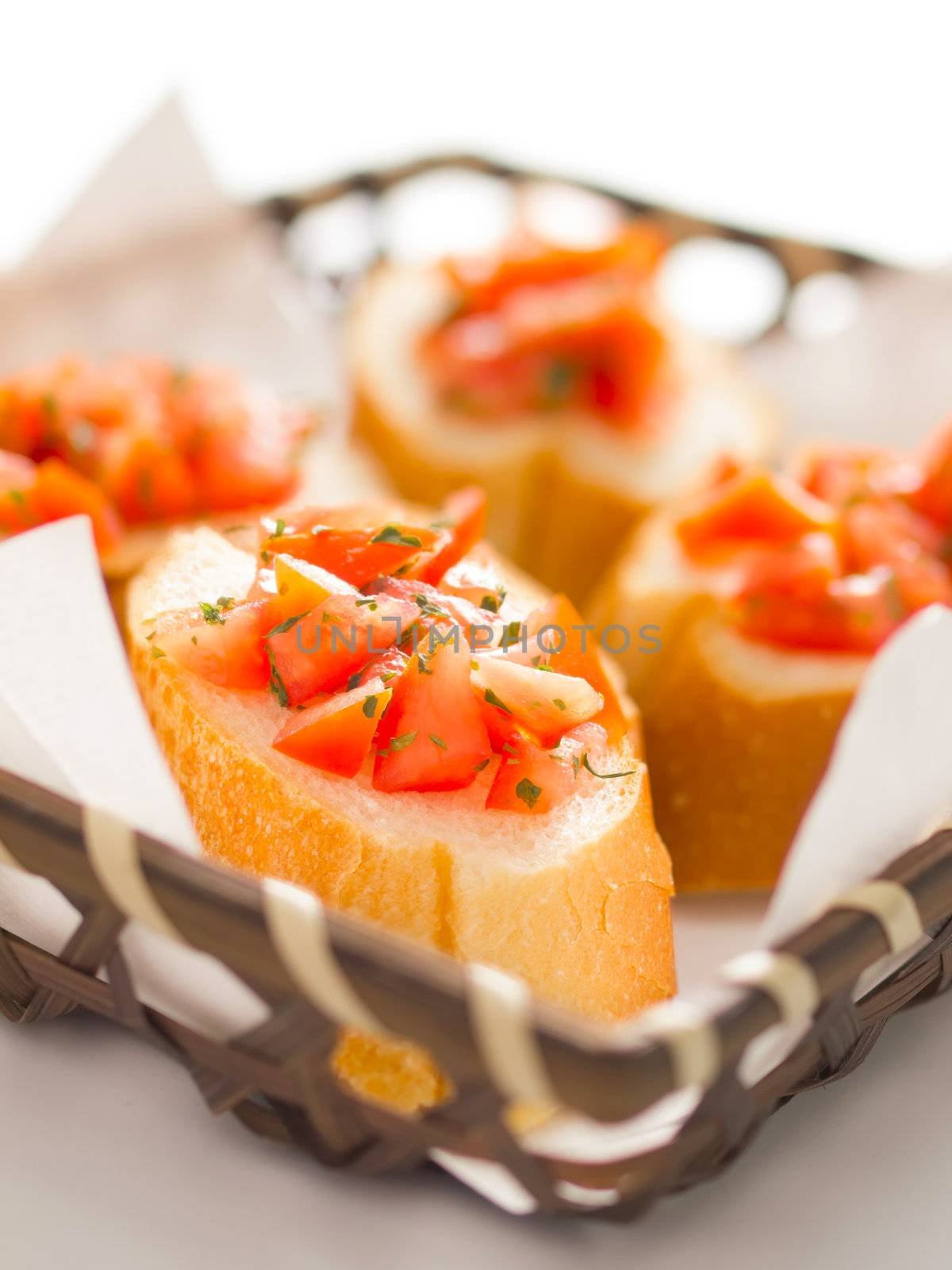 close up of a basket of bruschetta bread