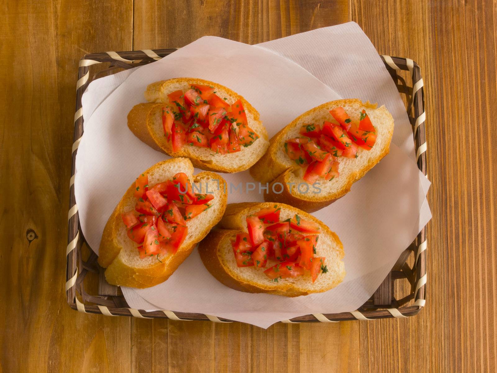 close up of a basket of bruschetta bread