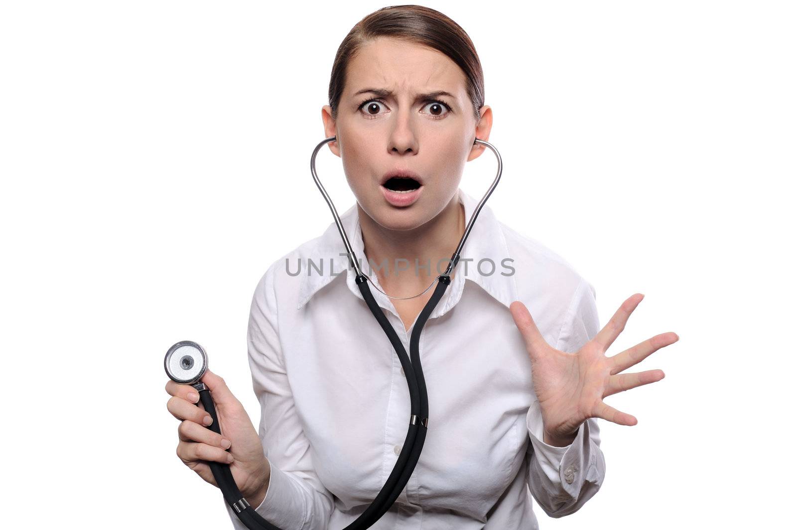 Doctor shocked - funny. Portrait of young female doctor or nurse surprised starring with big eyes. Isolated on white