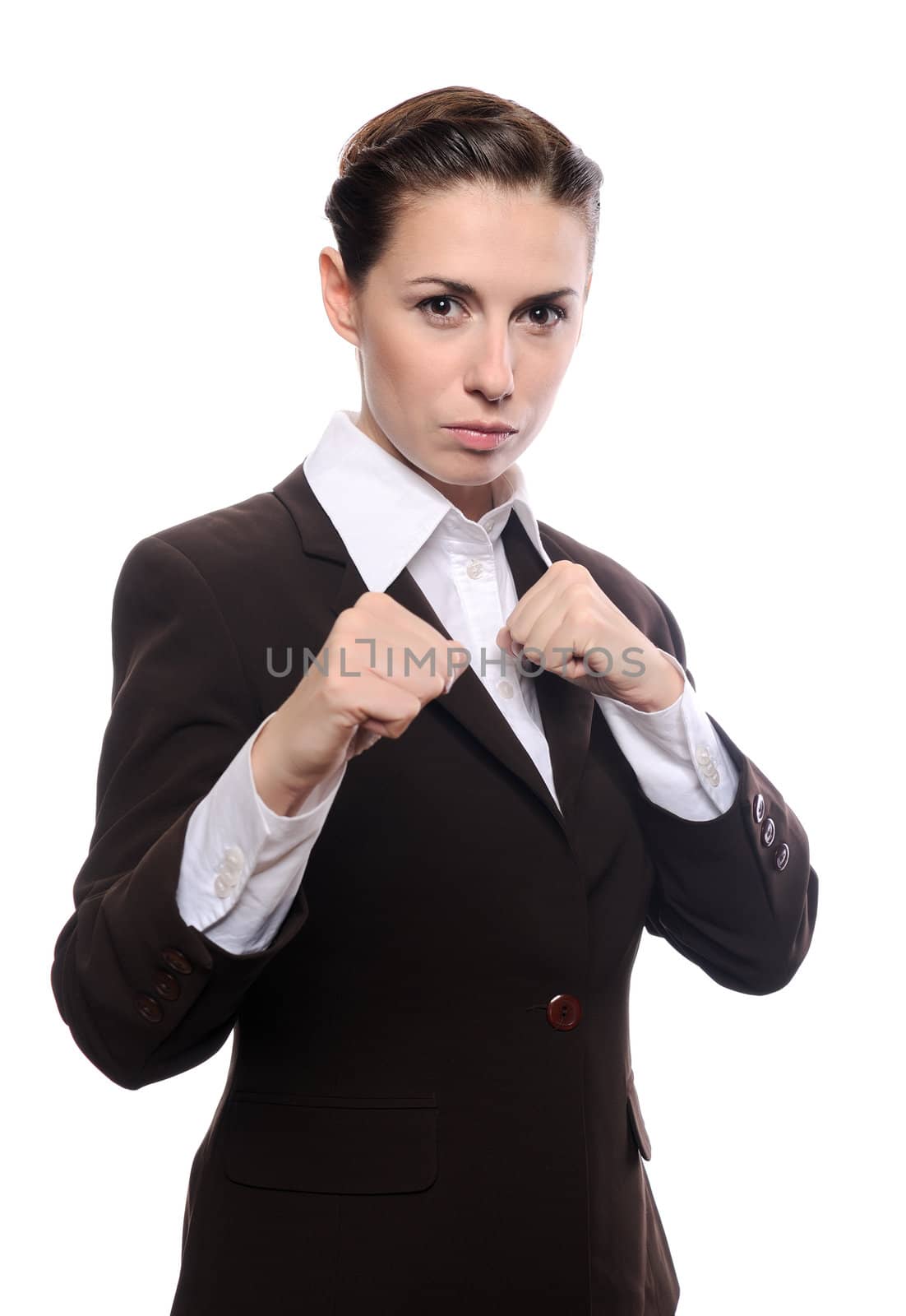 Portrait of an attractive young businesswoman punching. Isolated on white background