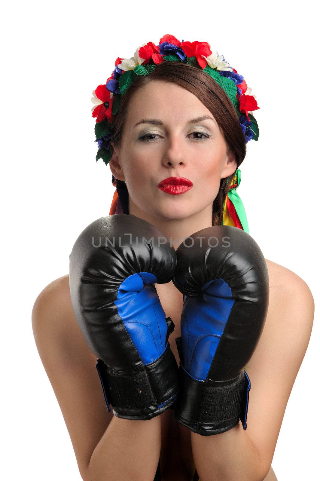 Girl with boxing gloves and floral wreath on her head kissing. Isolated on white background