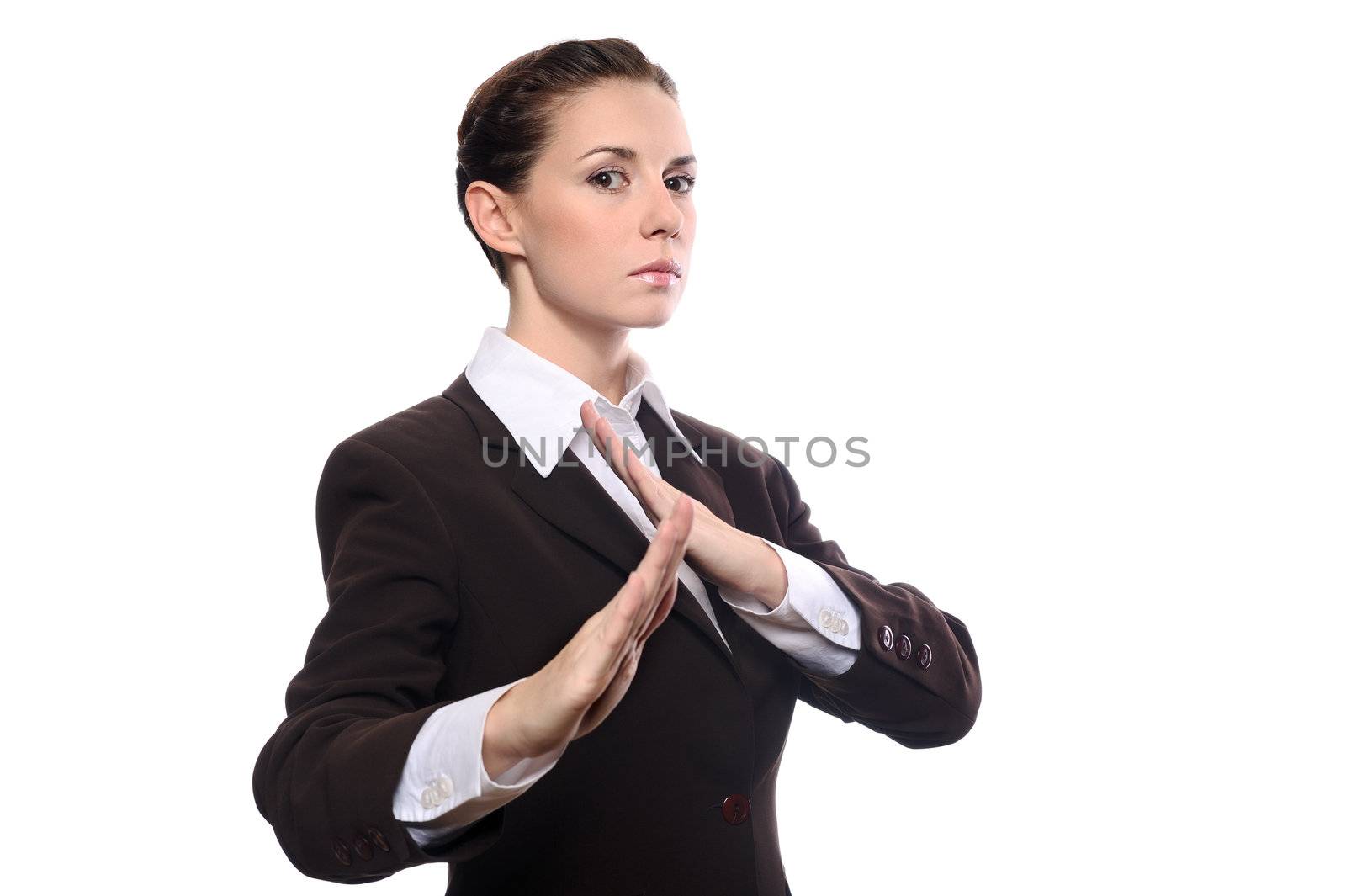 Karate business woman in defence pose isolating on white background