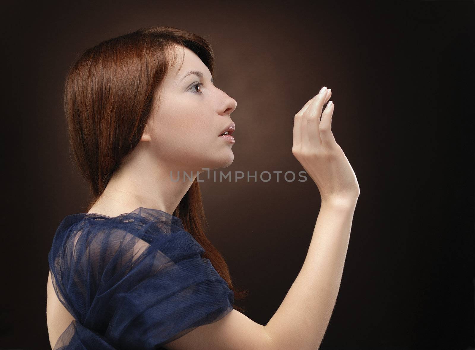 Portrait of young beautiful woman making gesture