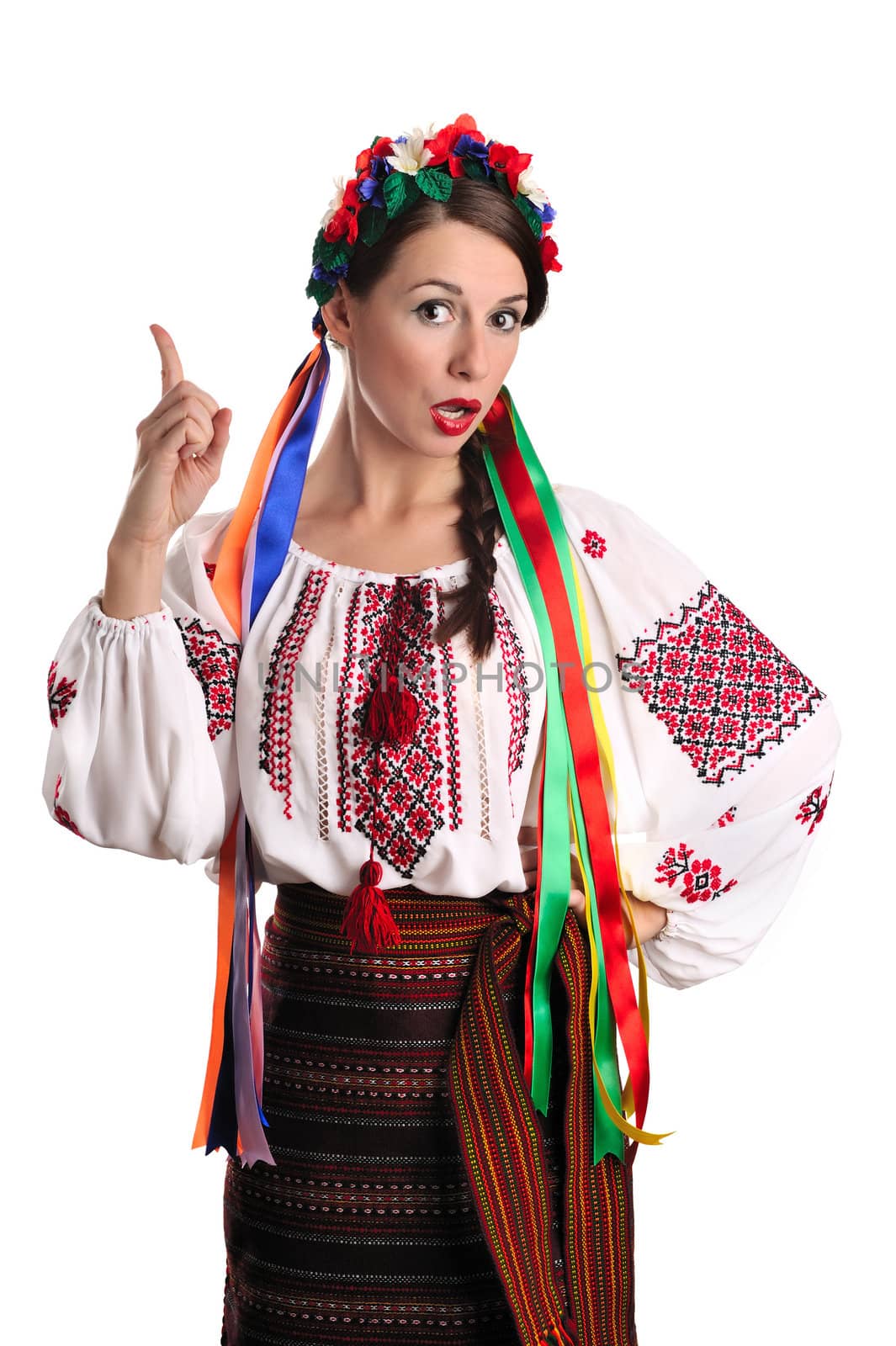 Portrait of joyful young Ukrainian woman in national costume. Isolated on white background