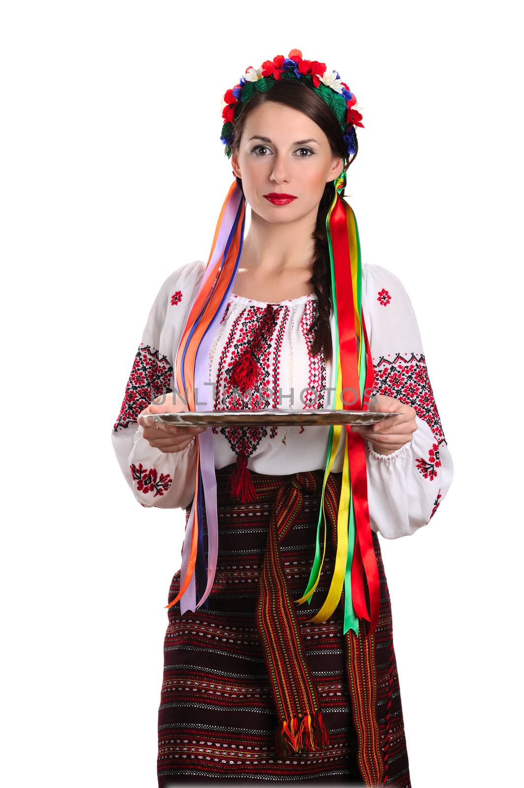 Young Ukrainian woman in national costume holding epmty tray. Isolated on white background