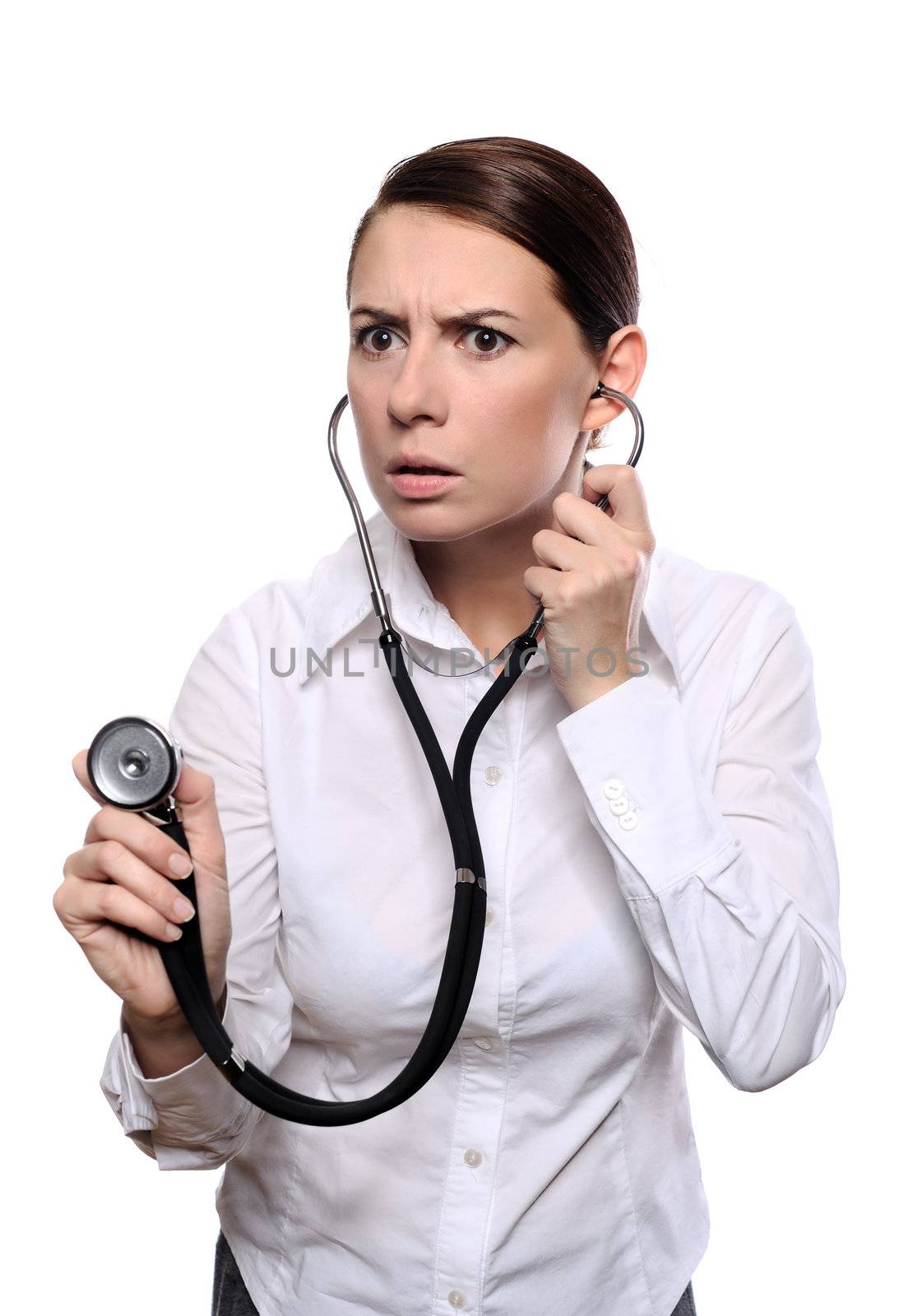 Frightened female doctor listen with a stethoscope isolated on white background