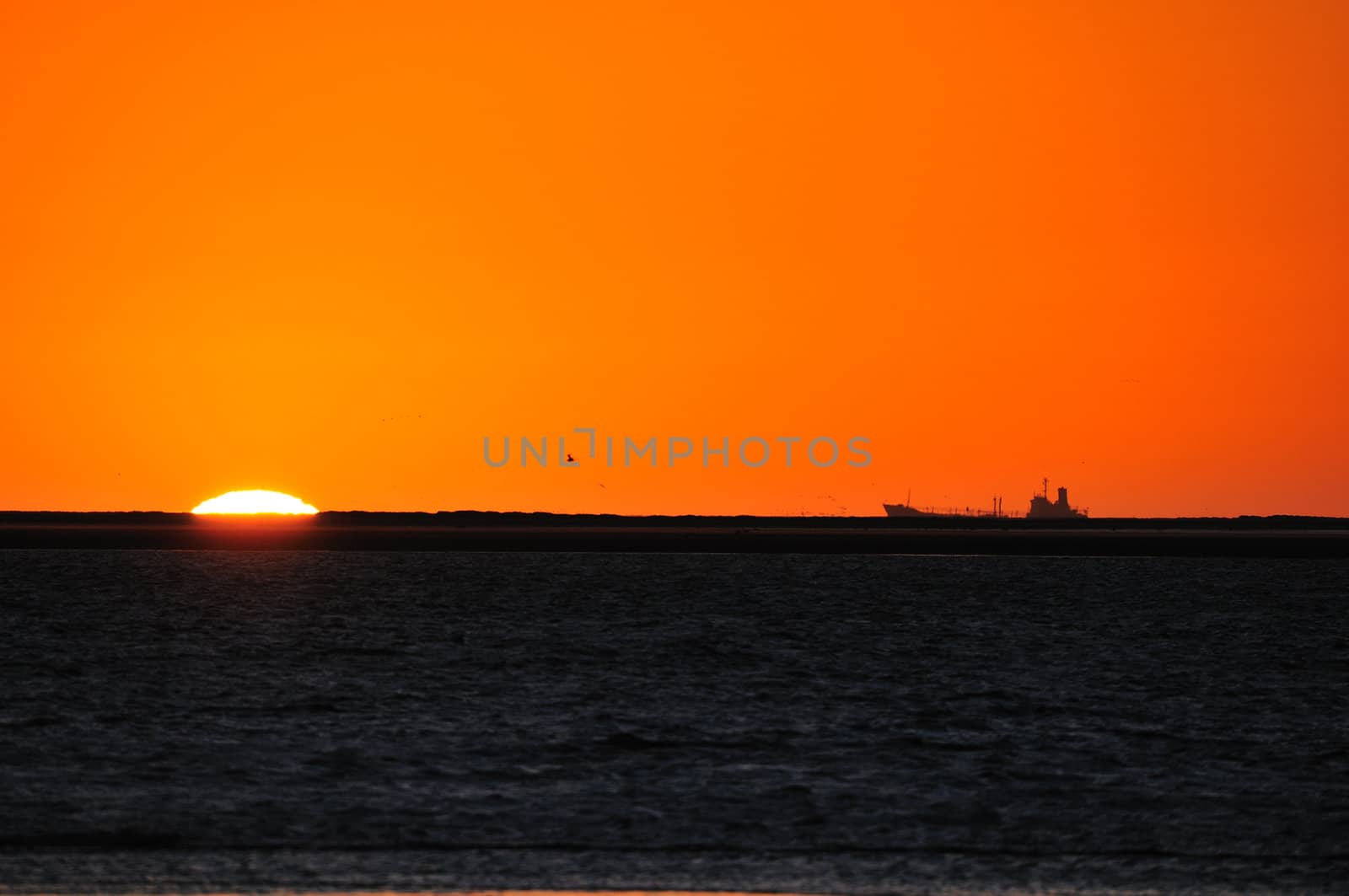 Ship silhouette against sunset at Walvisbaai, Namibia