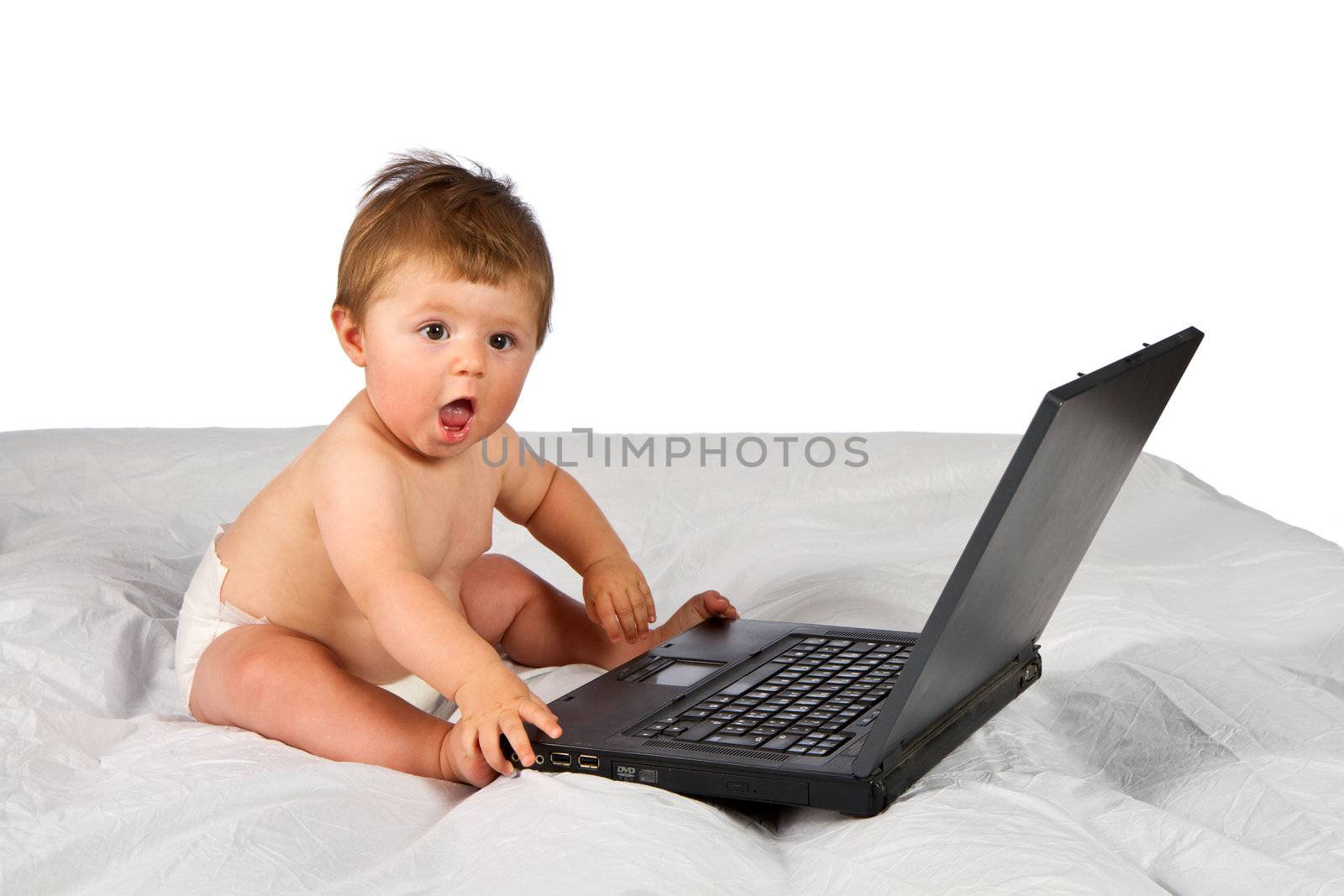 Child playing with  a laptop