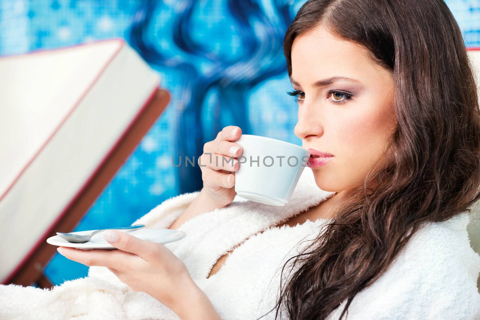 Woman enjoy cup of coffee in spa center