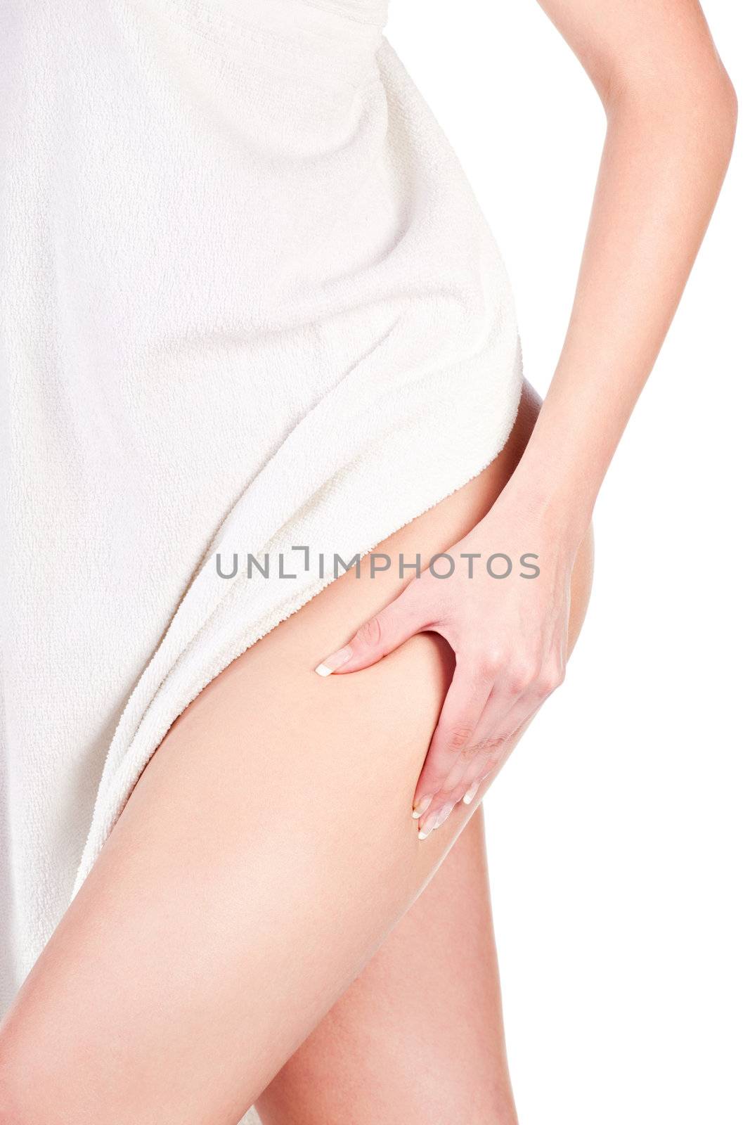 Woman with towel pinching leg for skin fold test, isolated on white