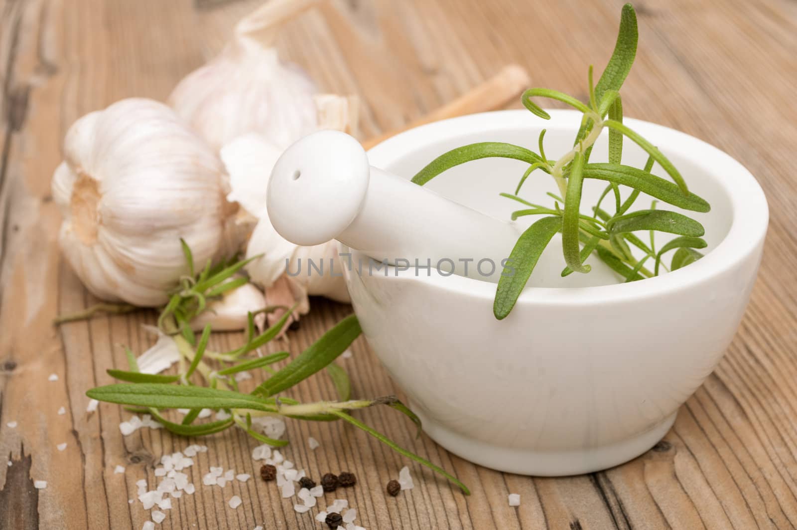 Mortar and Pestle With Ingredients - Rosemary, Salt, Pepper and Garlic