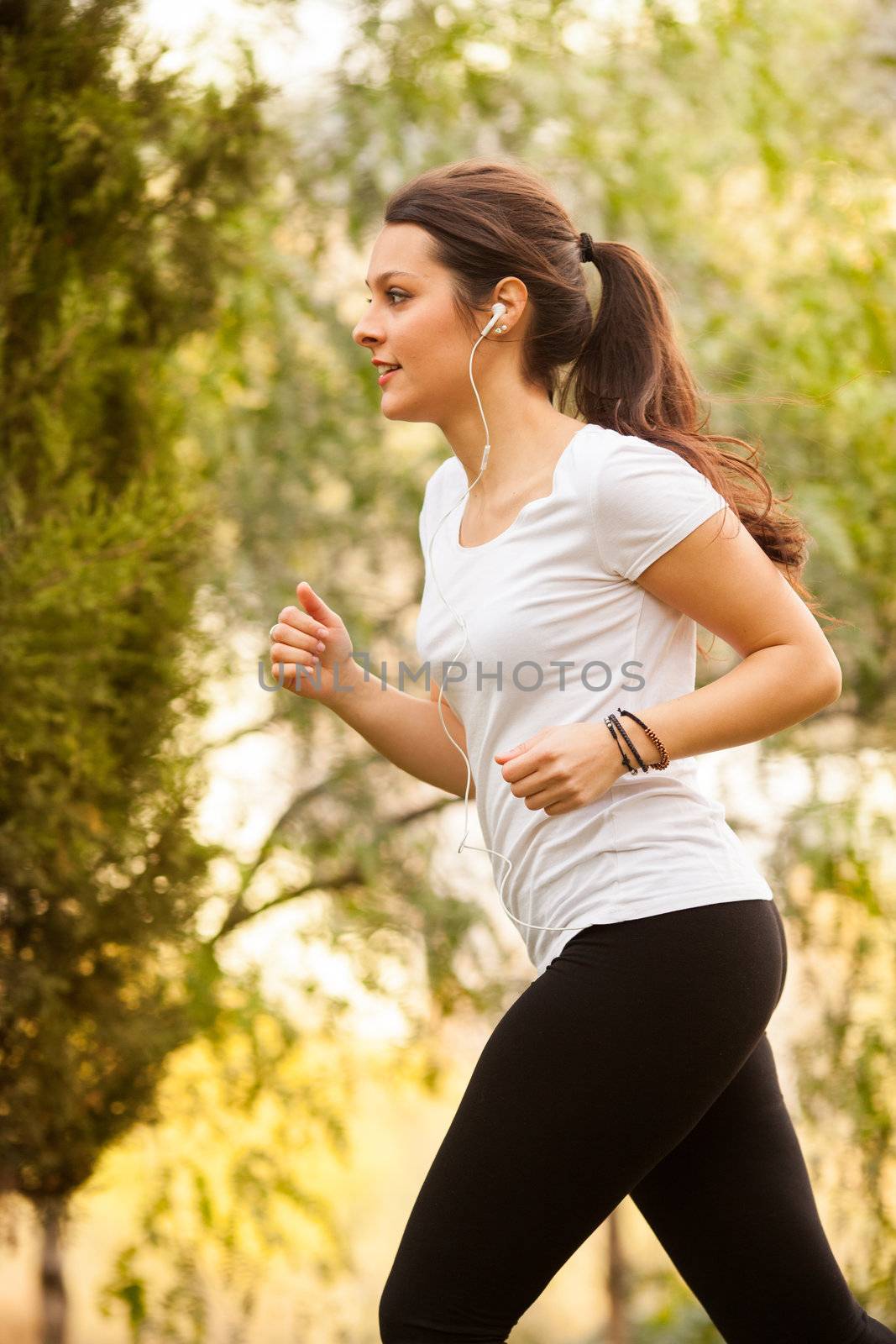 young beautiful woman jogging outdoors