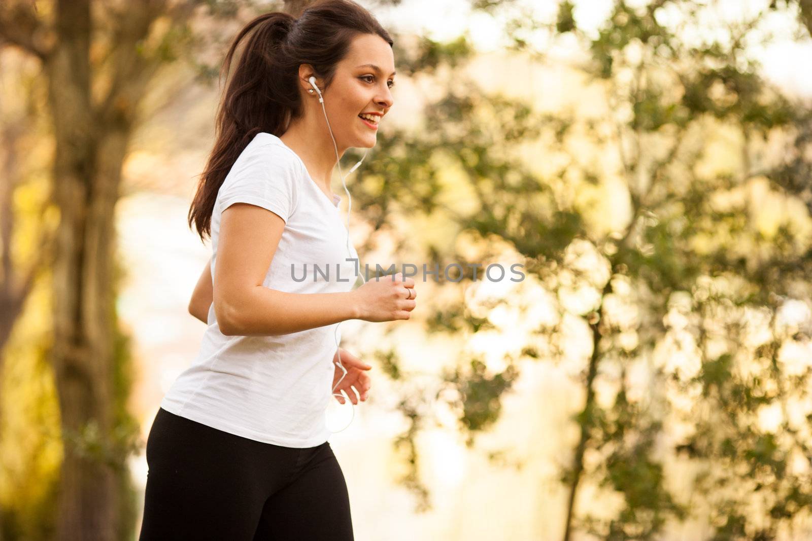 young beautiful woman jogging outdoors