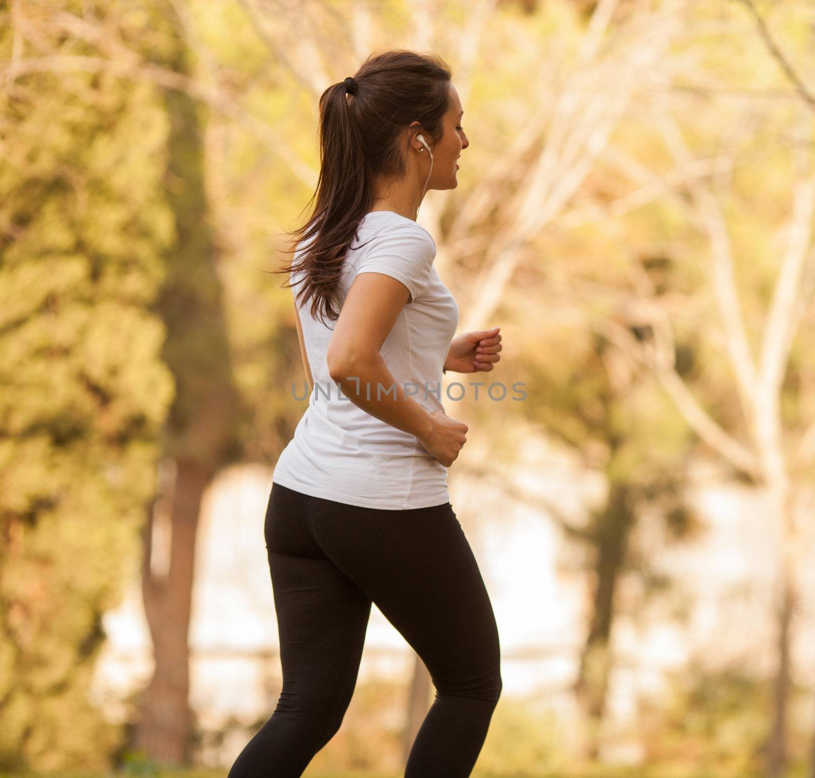 young beautiful woman jogging outdoors