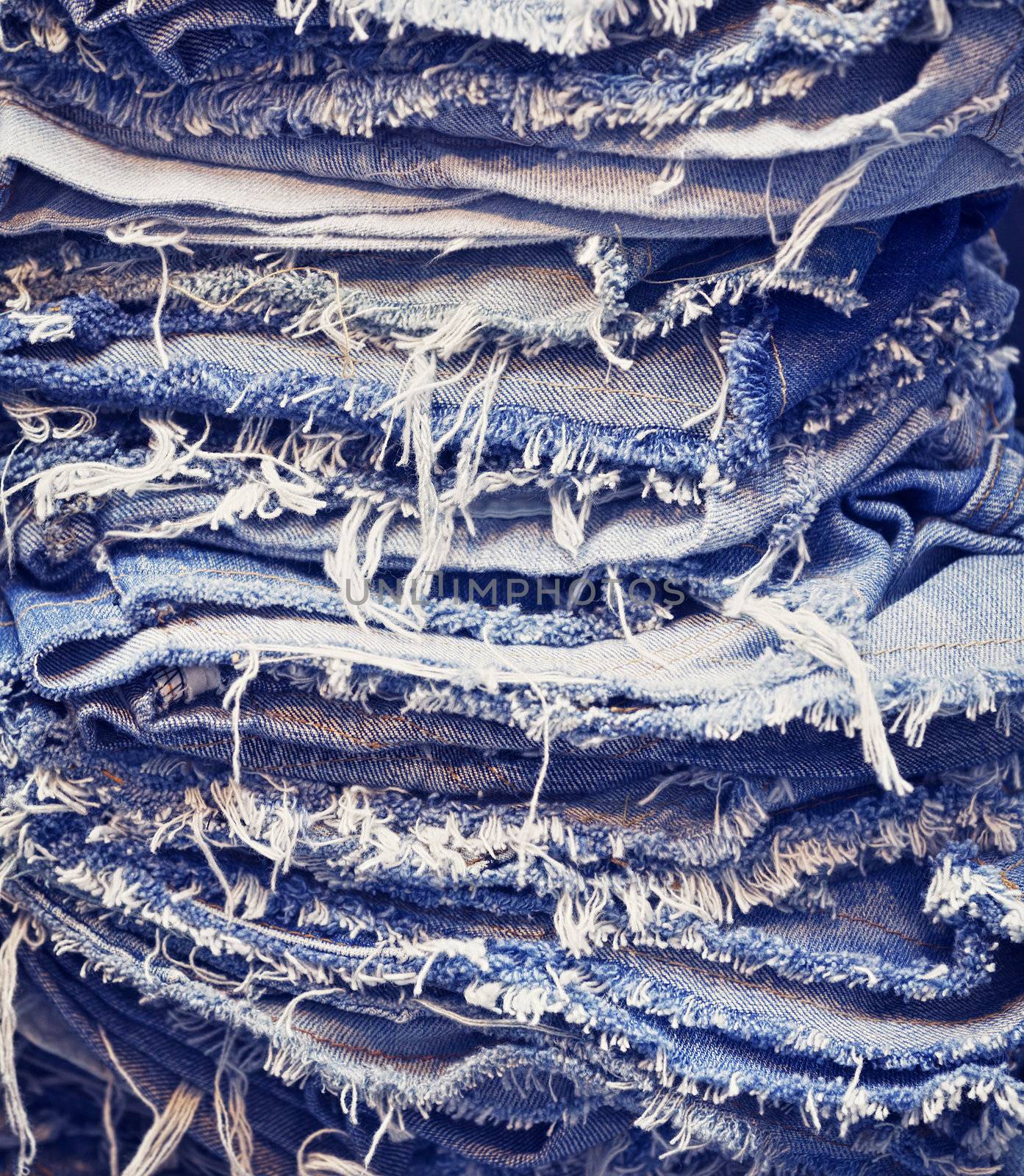 Torn jeans in stack by pzaxe