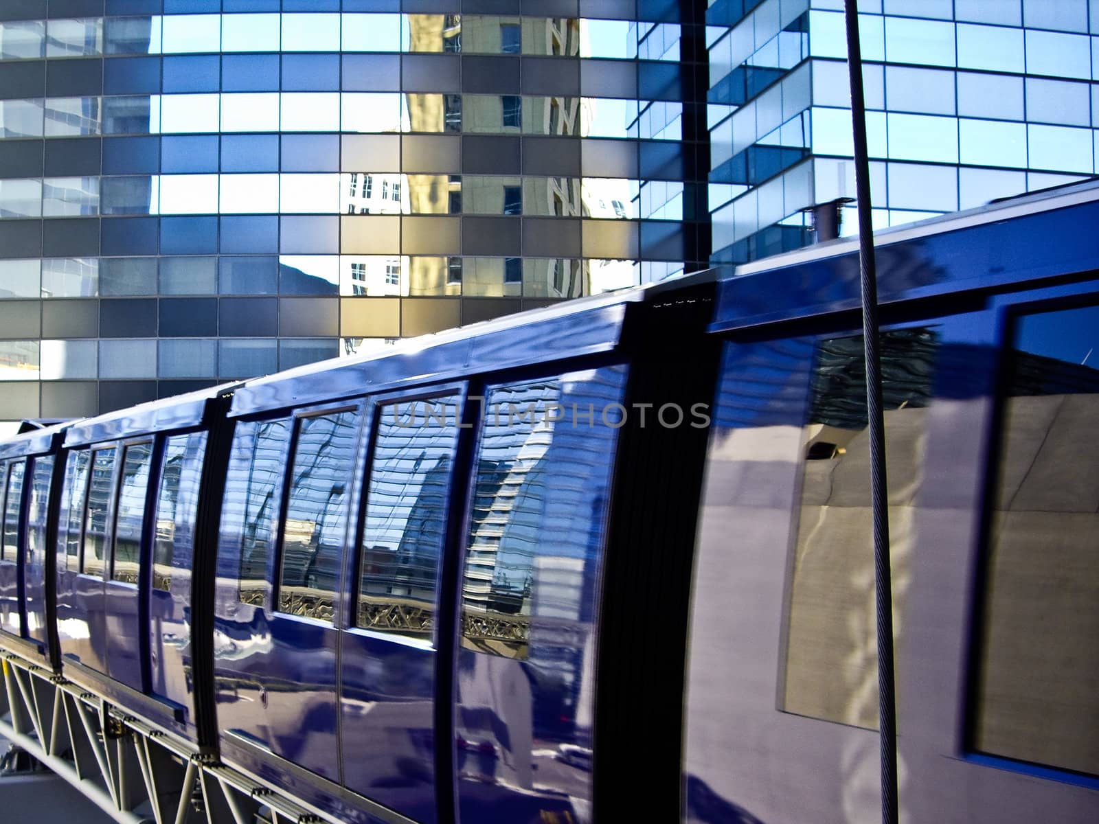 Blue monorail tram reflects Las Vegas by emattil
