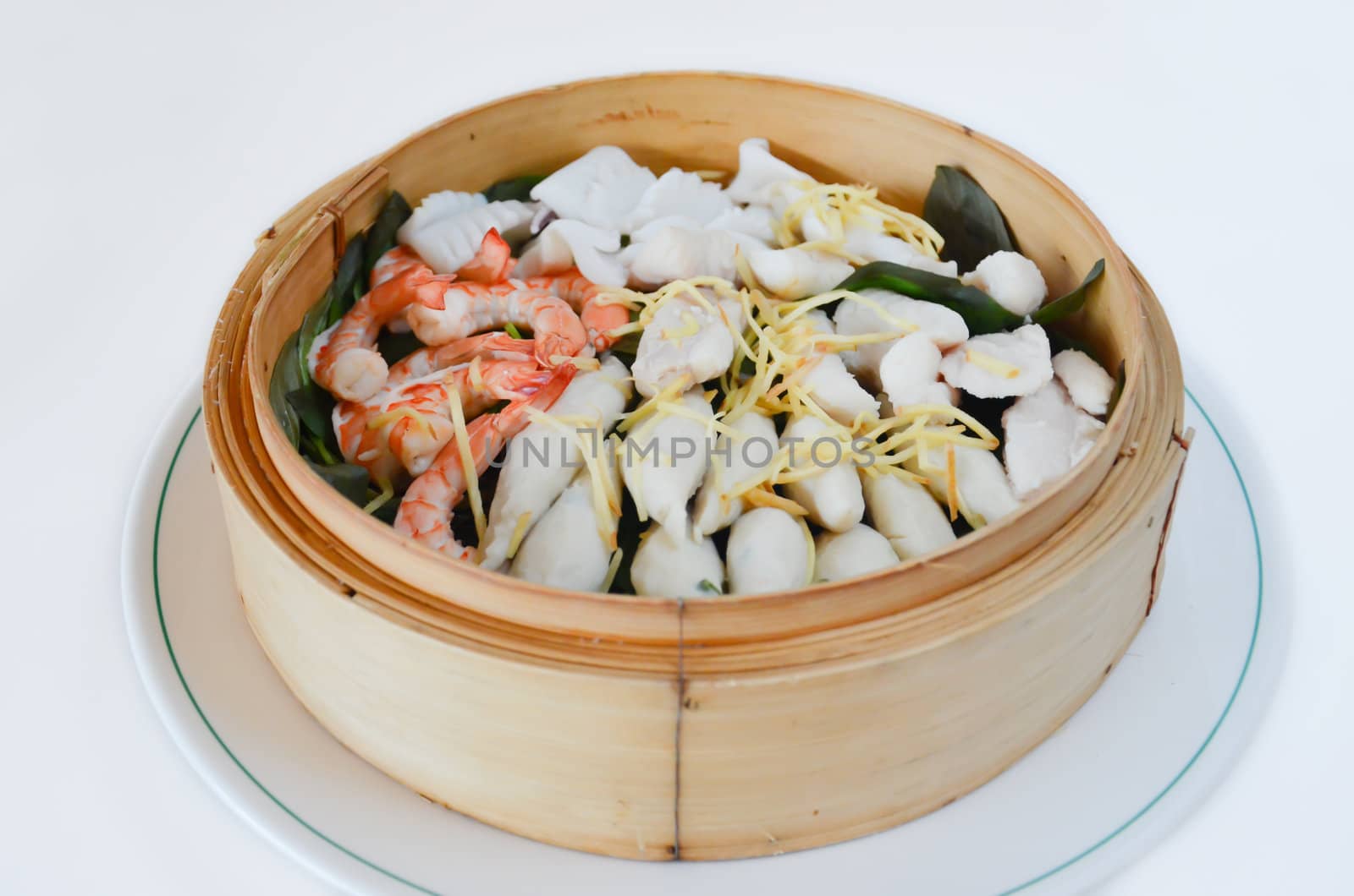 steamed seafood in a bamboo basket
