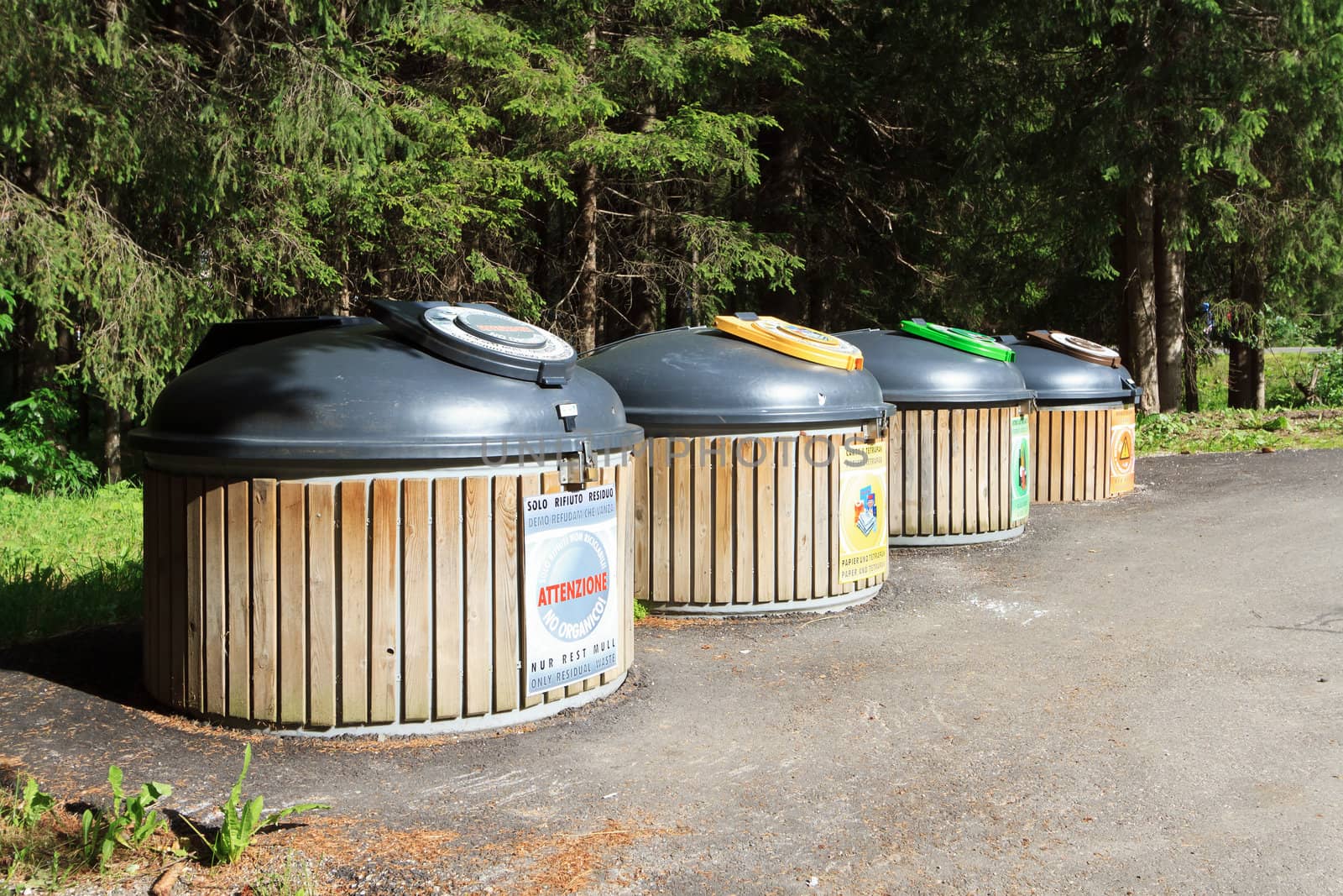 four wooden recycle bins for waste segregation 