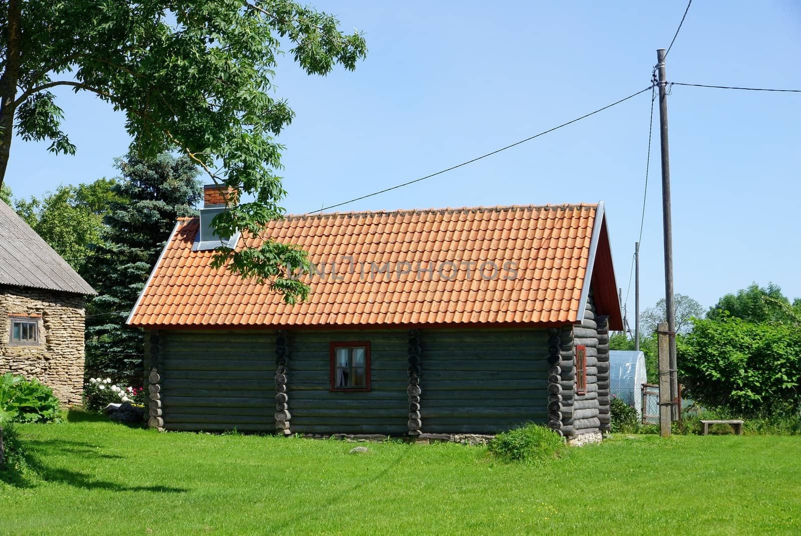 Wooden shed with a roof from a cane