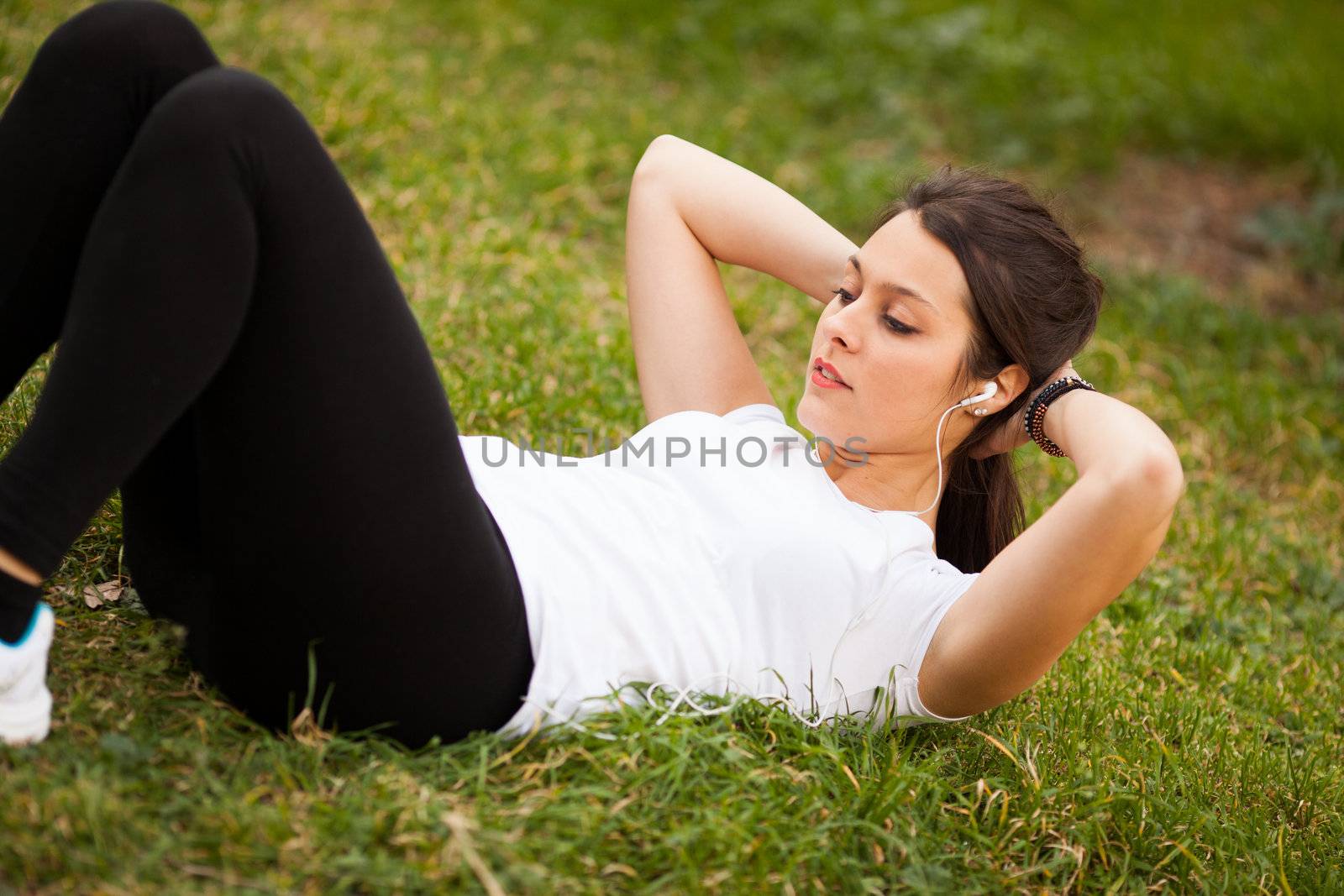 young beautiful latin woman making abs by Lcrespi