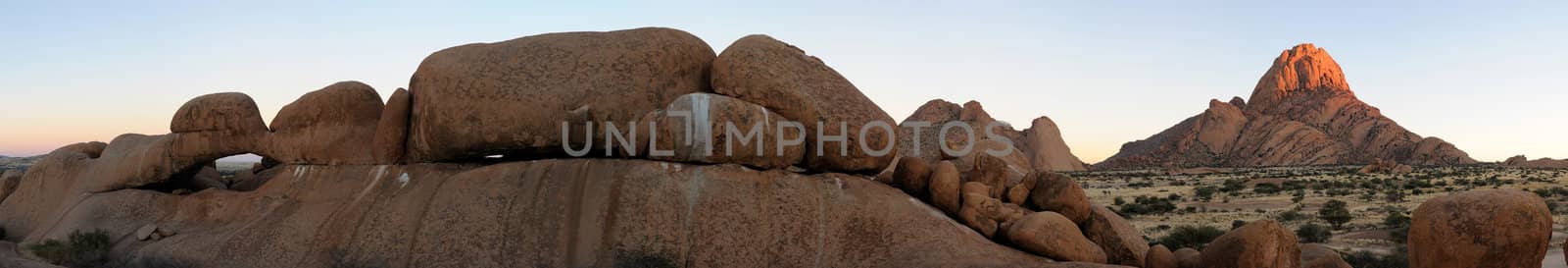 Panorama from eleven photos of the natural arch and Spitzkoppe in Namibia
