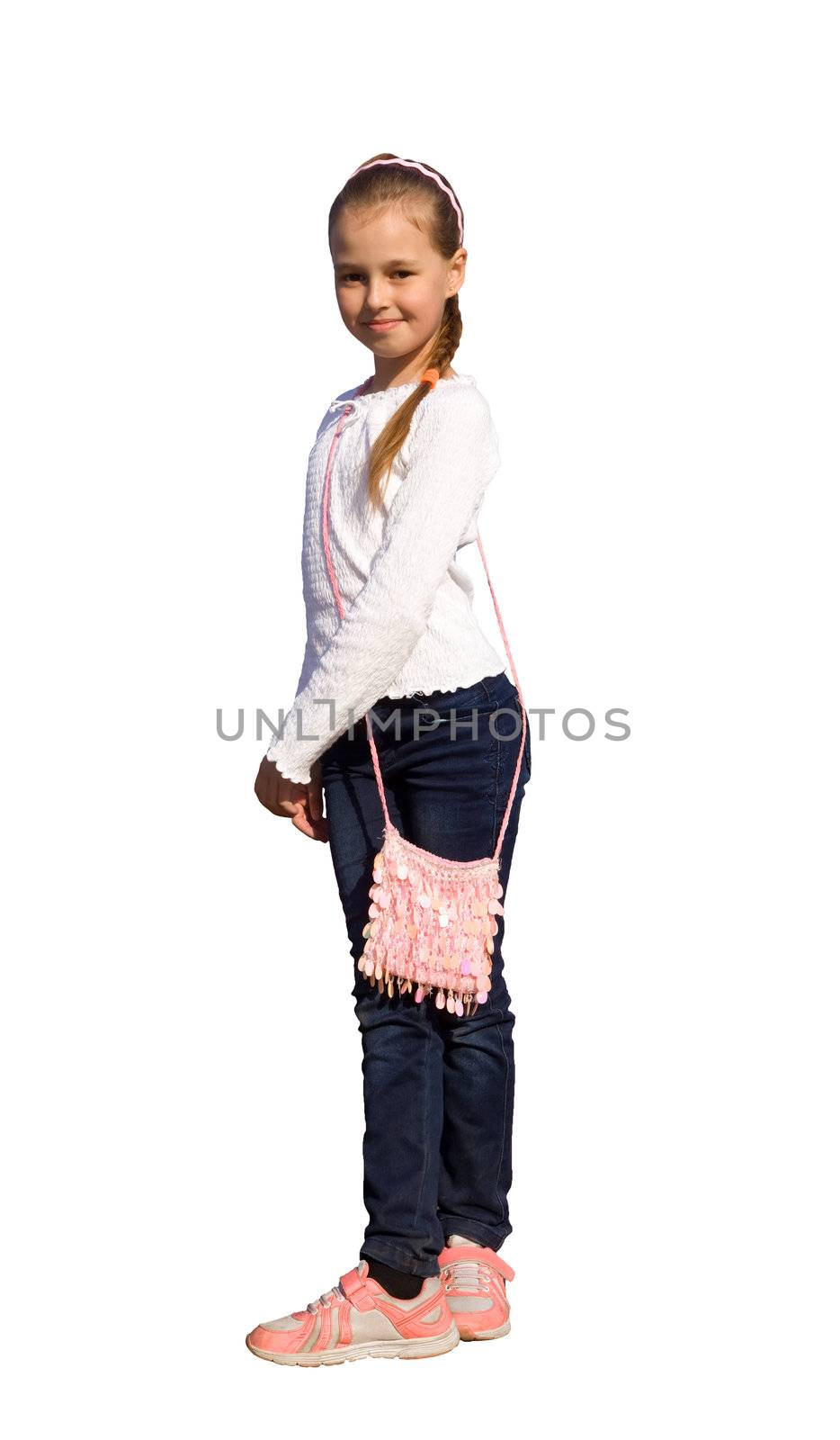 Little girl dancing in jeans and sneakers. Isolated on white background